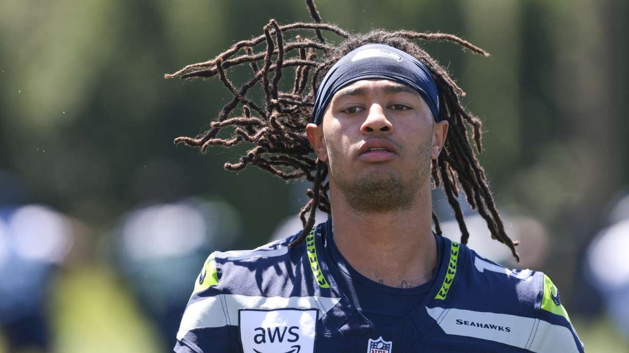 Seattle Seahawks wide receiver Jaxon Smith-Njigba warms up during NFL football training camp in Renton, Wash., Wednesday, July 24, 2024.