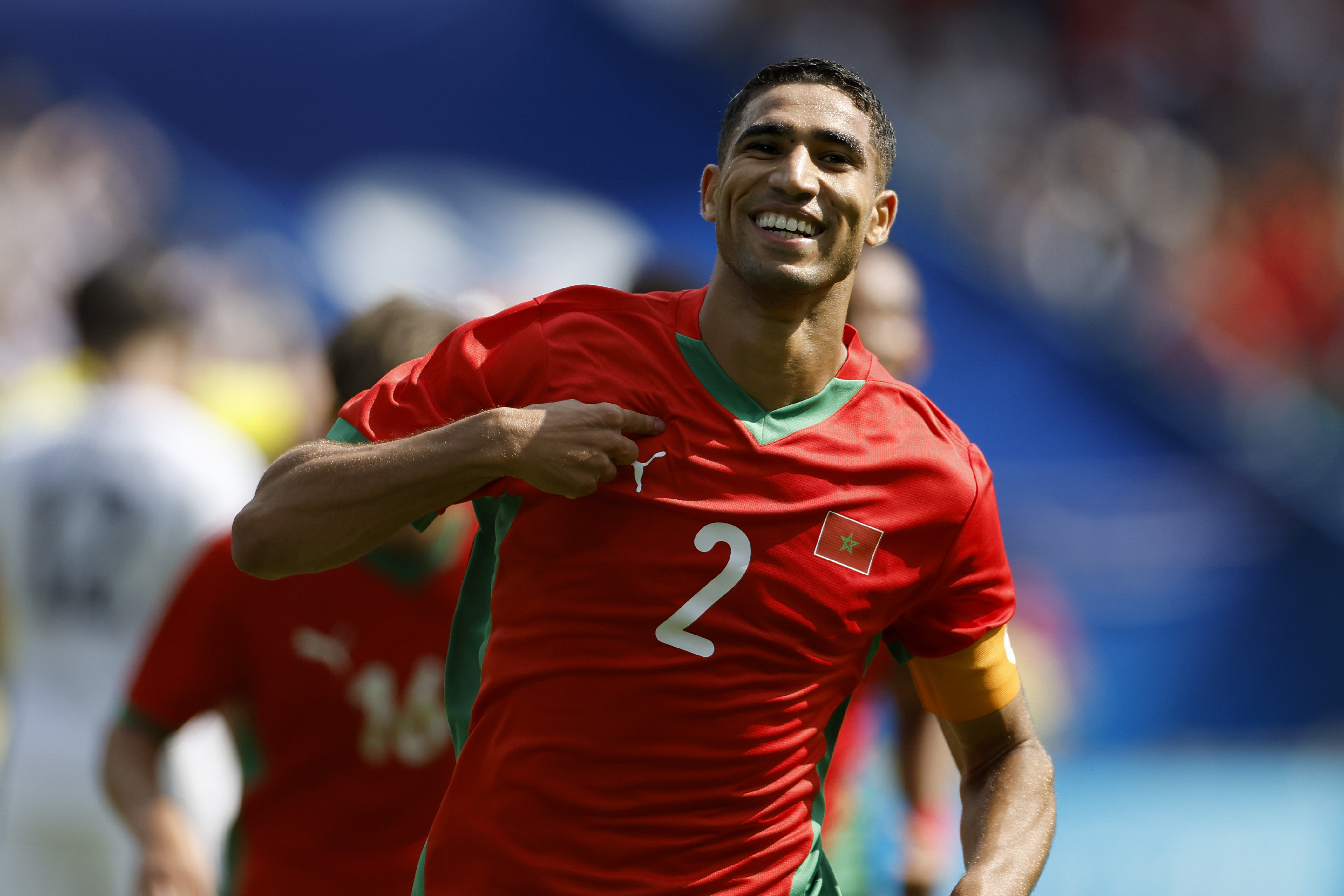 Morocco's Achraf Hakimi celebrates scoring his side's third goal during the quarterfinal men's soccer match between Morocco and the United States at the Parc des Princes during the 2024 Summer Olympics, Friday, Aug. 2, 2024, in Paris, France. 
