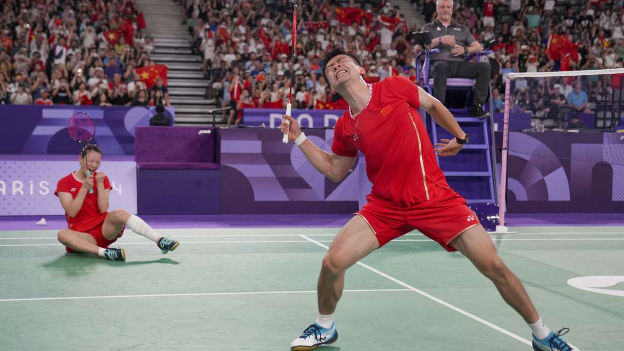 China's Zheng Si Wei, right, and Huang Ya Qiong celebrate after defeating South Korea's Kim Won-ho and Jeong Na-eun in their mixed doubles badminton final match at the 2024 Summer Olympics, Friday, Aug. 2, 2024, in Paris, France.