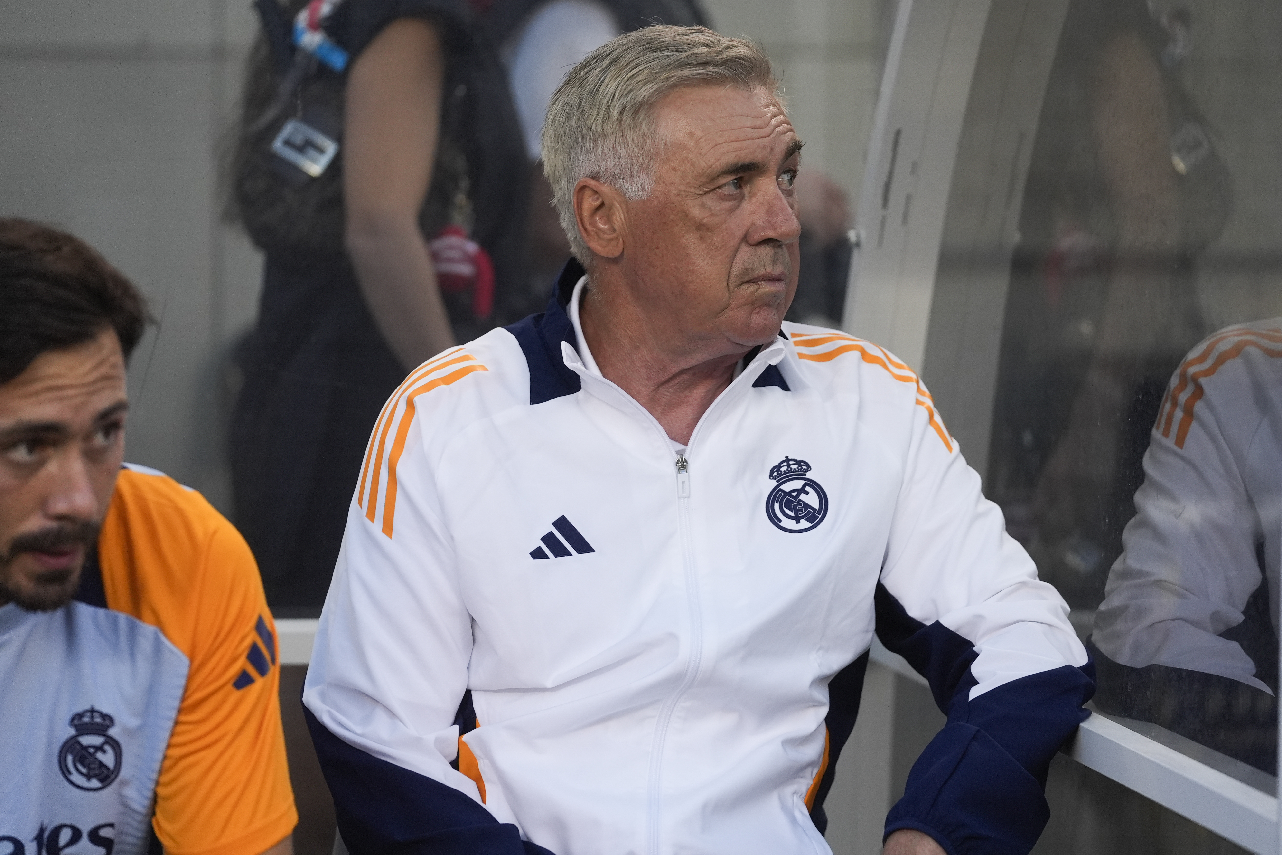 Real Madrid coach Carlo Ancelotti sits on the bench before a friendly soccer match against AC Milan, Wednesday, July 31, 2024, in Chicago. 