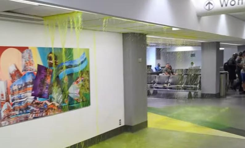 Green slime drips from the ceiling at Miami International Airport in this July 4 video. What could have caused this?