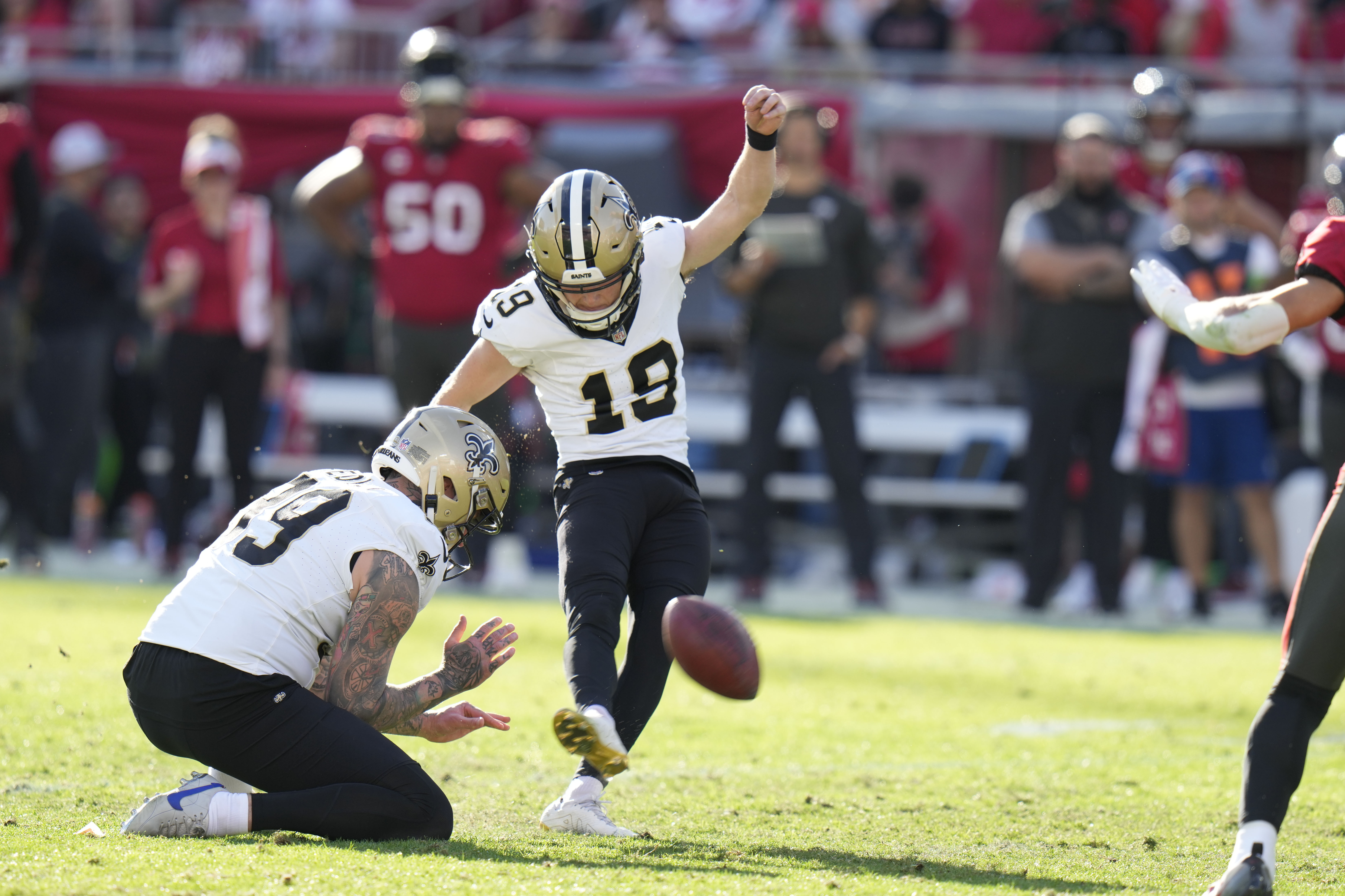 FILE - New Orleans Saints place kicker Blake Grupe (19) kicks a field goal in the second half of an NFL football game against the Tampa Bay Buccaneers in Tampa, Fla., Sunday, Dec. 31, 2023.