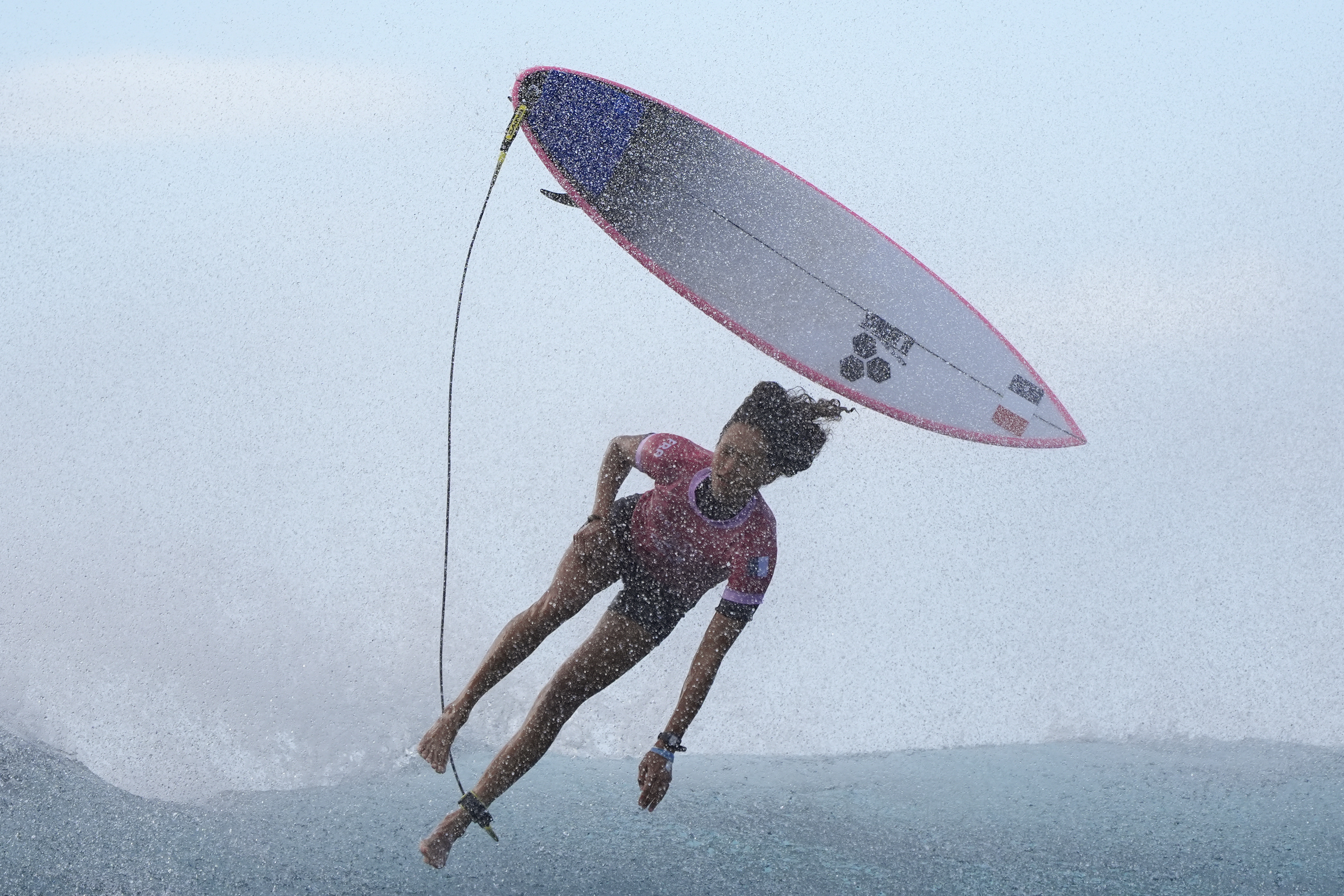 Vahine Fierro, of France, kicks off of a wave during the third round of the 2024 Summer Olympics surfing competition, Thursday, Aug. 1, 2024, in Teahupo'o, Tahiti.
