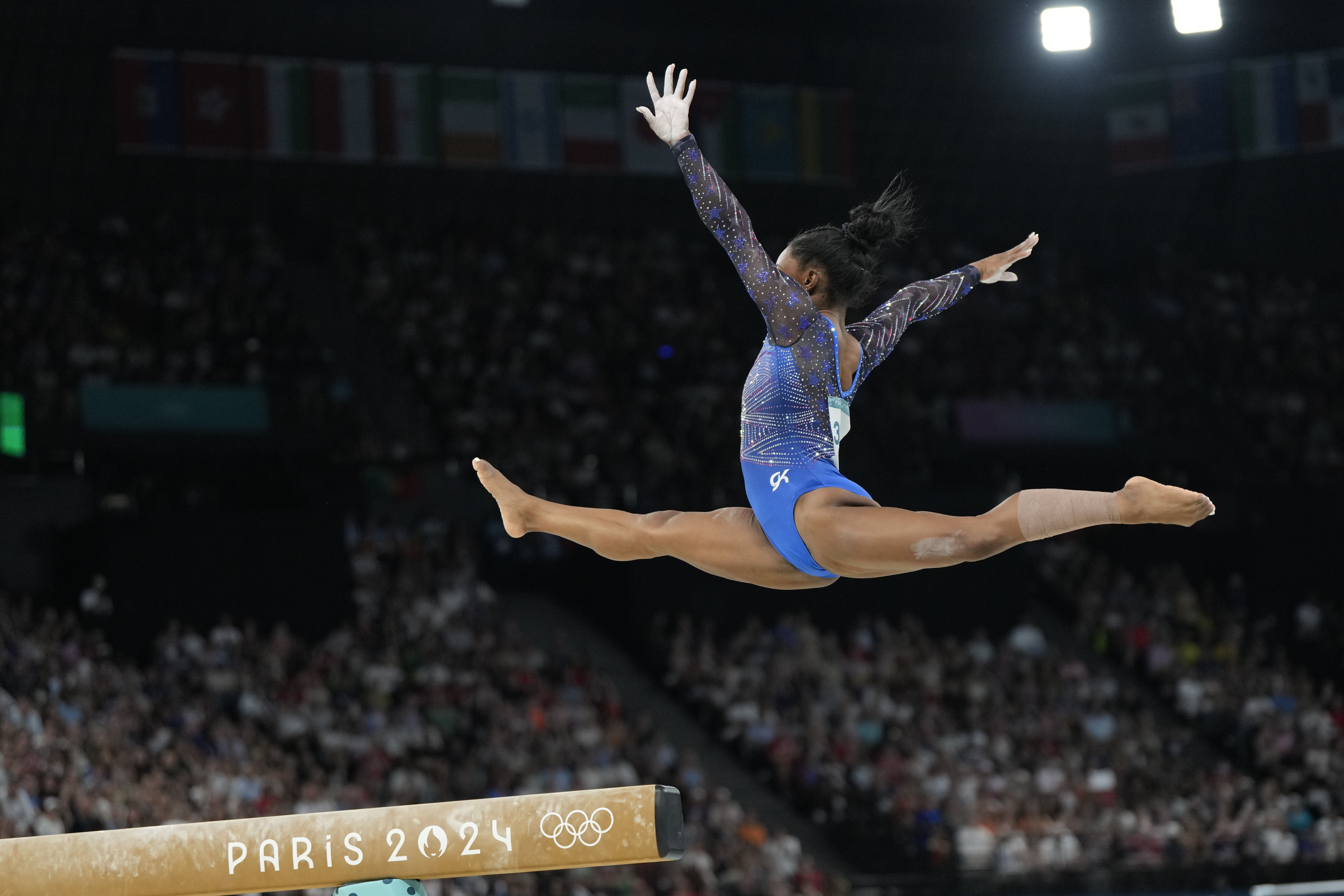 Simone Biles, of the United States, performs on the balance beam during the women's artistic gymnastics all-around finals in Bercy Arena at the 2024 Summer Olympics, Thursday, Aug. 1, 2024, in Paris, France. 