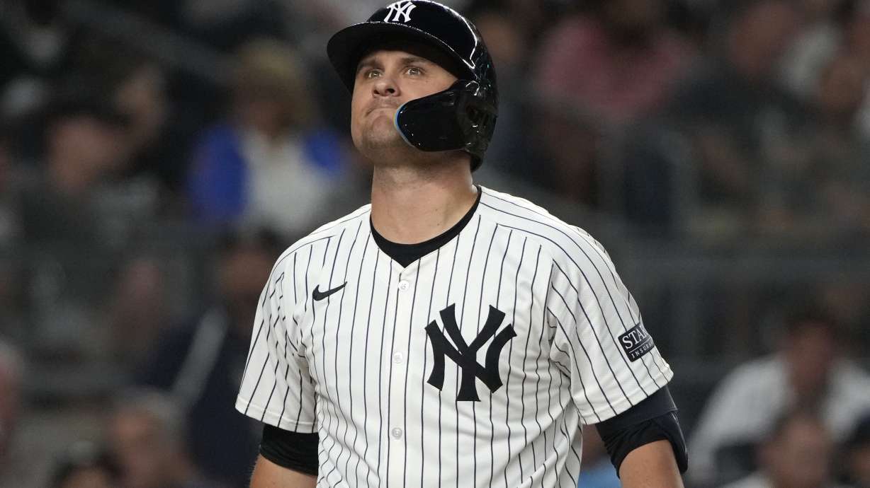 New York Yankees' J.D. Davis reacts after striking out during the sixth inning of a baseball game against the New York Mets, Wednesday, July 24, 2024, in New York.