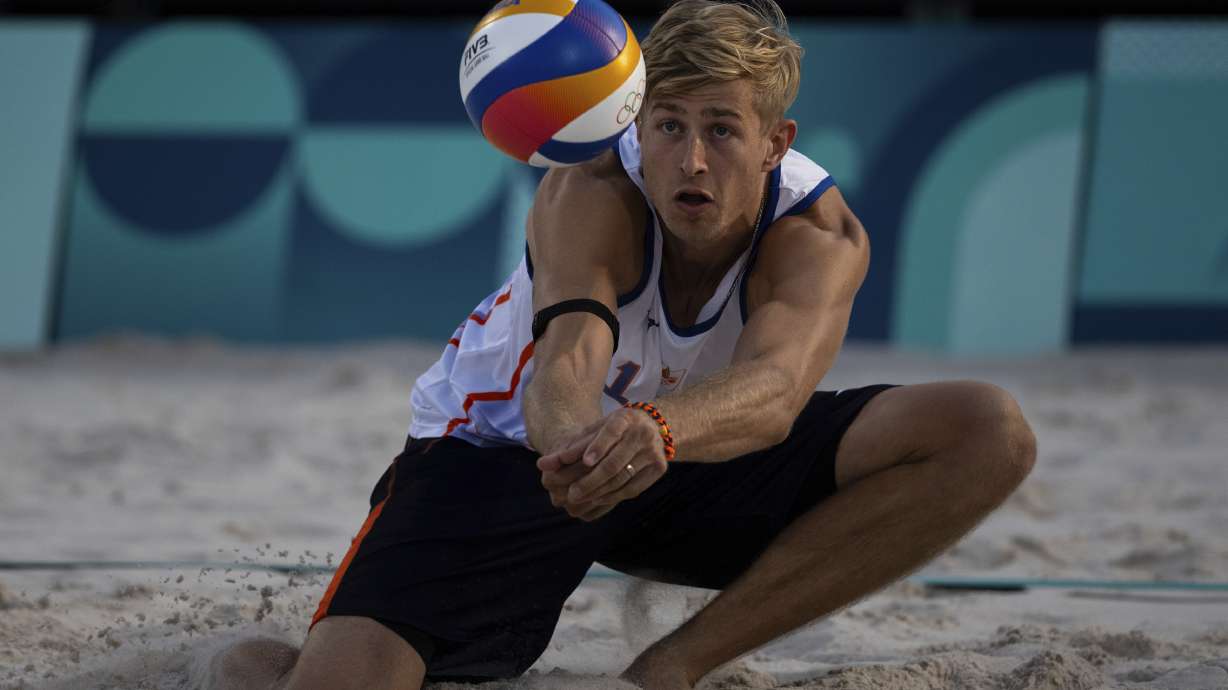 Netherlands' Steven Van De Velde hits the ball during the men's pool B beach volleyball match between Norway and Netherlands at Eiffel Tower Stadium at the 2024 Summer Olympics, Friday, Aug. 2, 2024, in Paris, France.