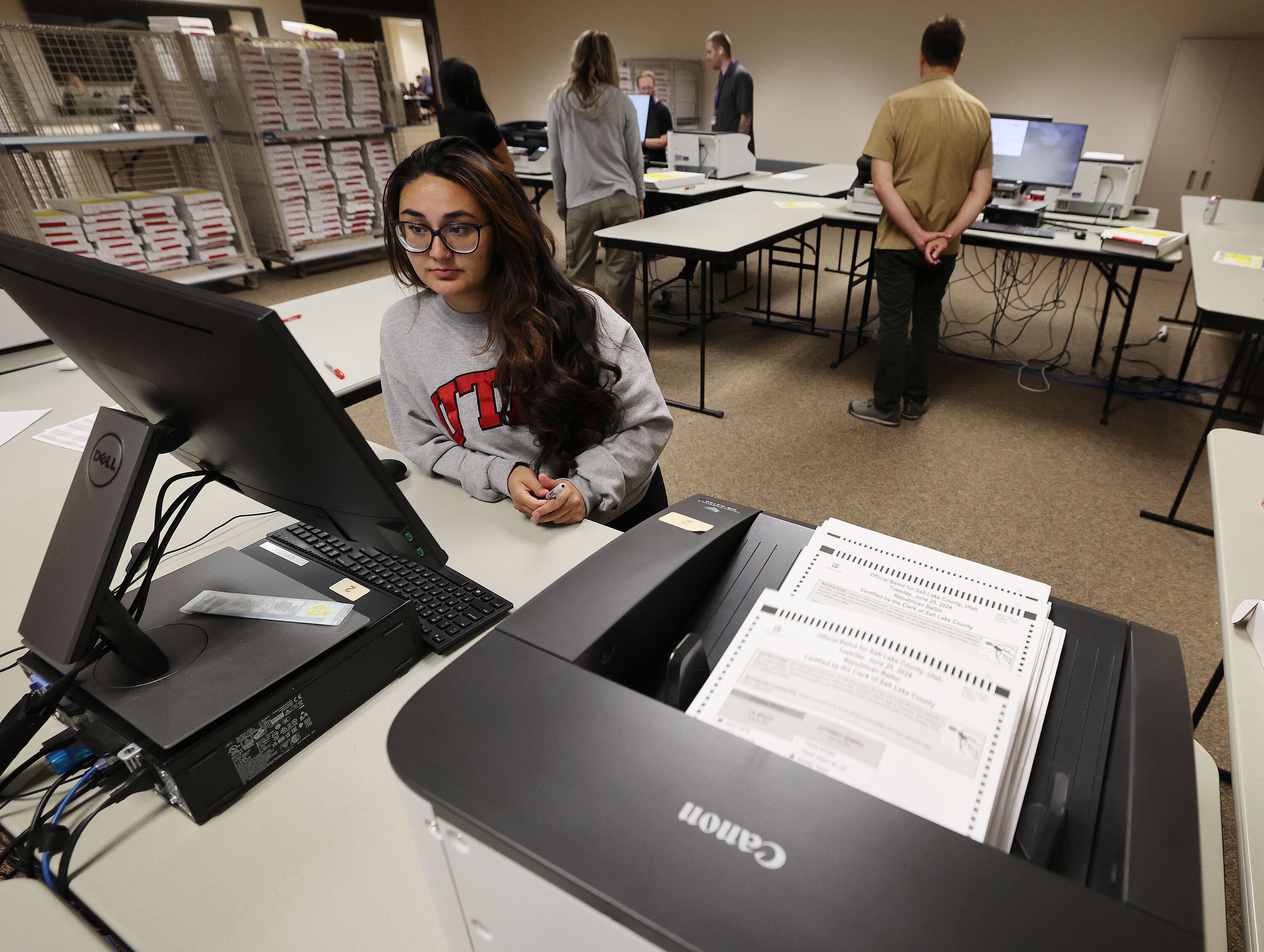 Latifa Yaquobi begins recounting the Colby Jenkins and Rep. Celeste Maloy race ballots at the Salt Lake County Clerk's office in Salt Lake City on Tuesday.