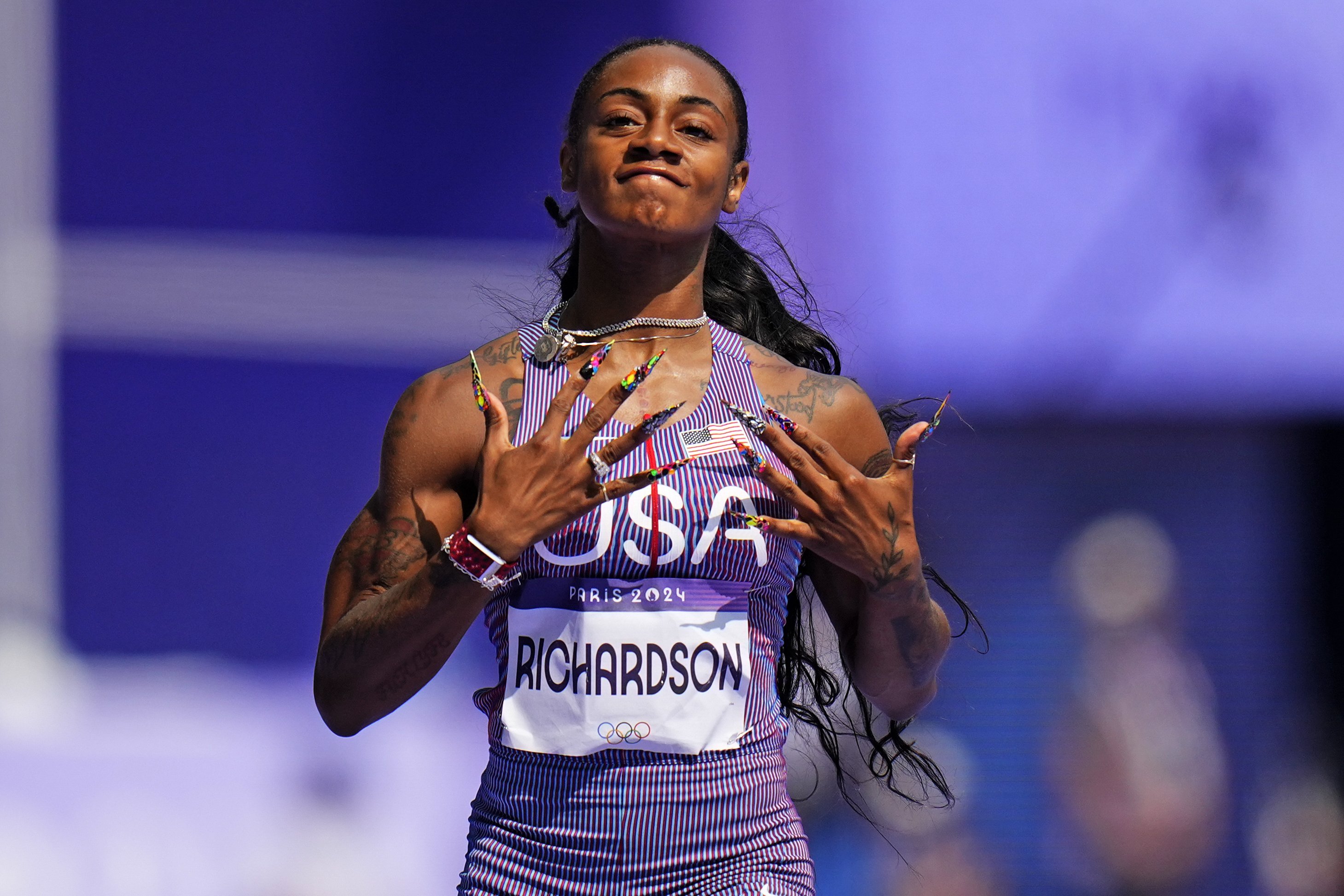 Sha'carri Richardson of the United States, wins a heat in the women's 100-meter run at the 2024 Summer Olympics, Friday, Aug. 2, 2024, in Saint-Denis, France. 