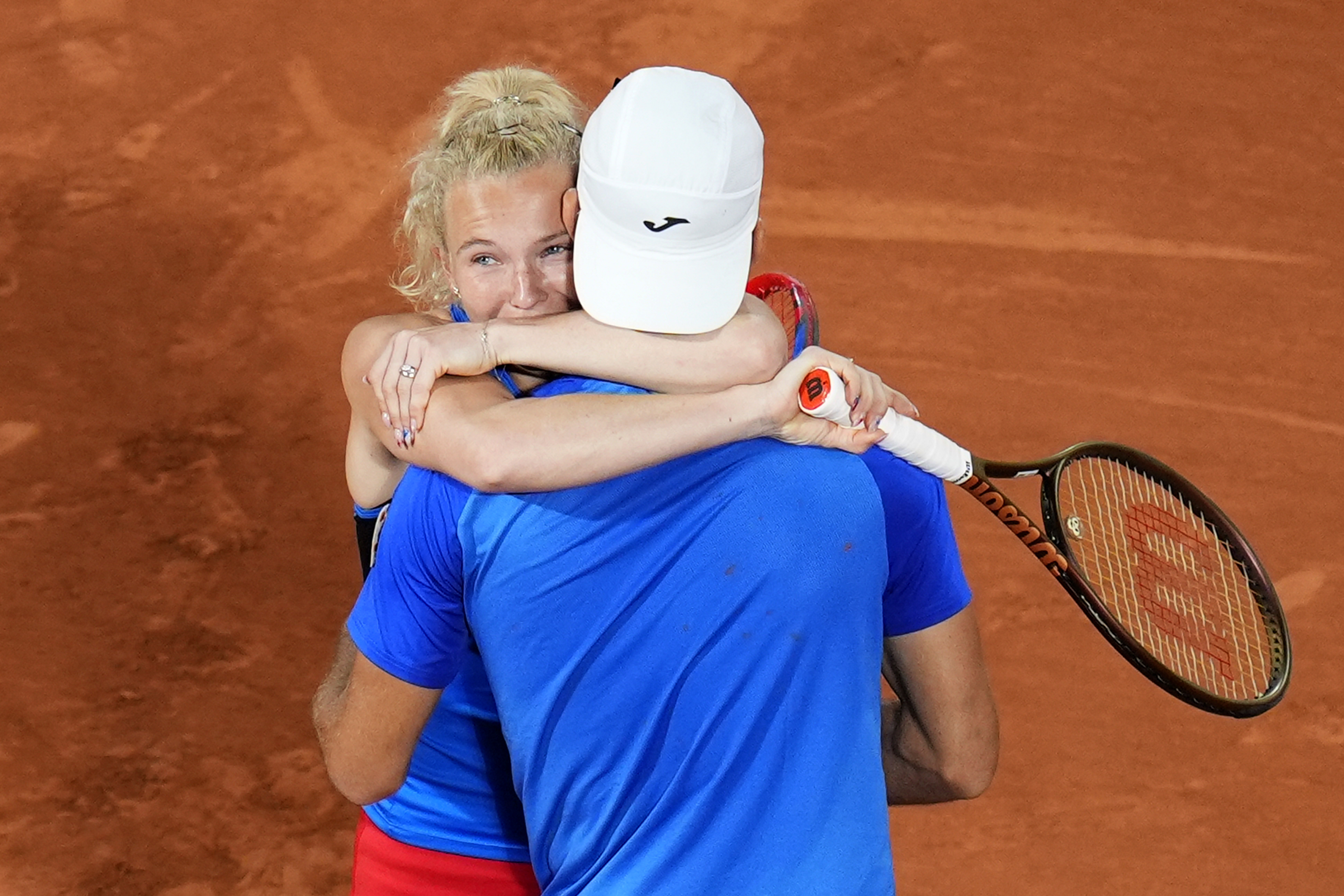 Czech Republic's Tomas Machac and Katerina Siniakova celebrate as they defeat China's Wang Xinyu and Zhang Zhizhen during the Mixed Doubles final tennis match at the Roland Garros stadium during the 2024 Summer Olympics, Friday, Aug. 2, 2024, in Paris, France. 