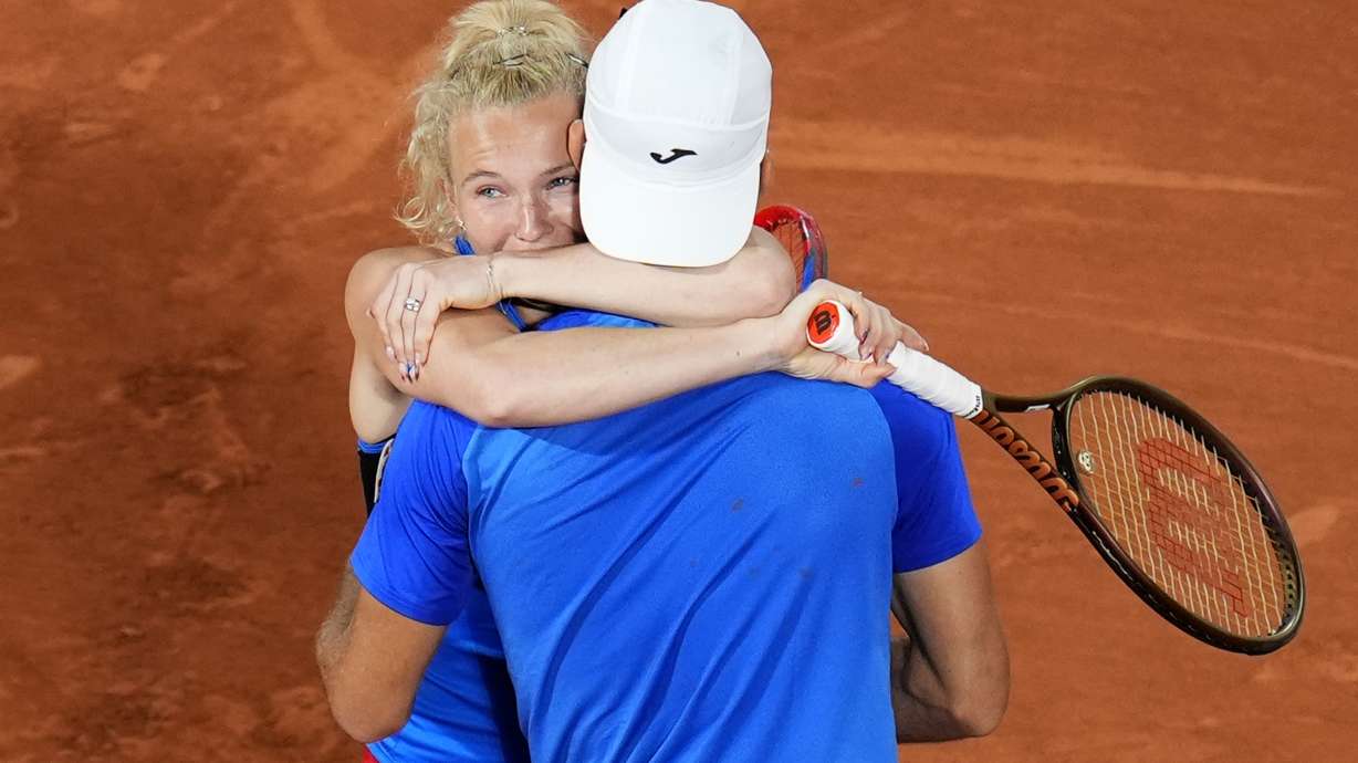Czech Republic's Tomas Machac and Katerina Siniakova celebrate as they defeat China's Wang Xinyu and Zhang Zhizhen during the Mixed Doubles final tennis match at the Roland Garros stadium during the 2024 Summer Olympics, Friday, Aug. 2, 2024, in Paris, France.