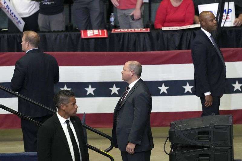 Members of the Secret Service look on as Republican presidential candidate former President Donald Trump speaks at a campaign event, July 20 in Grand Rapids, Mich.