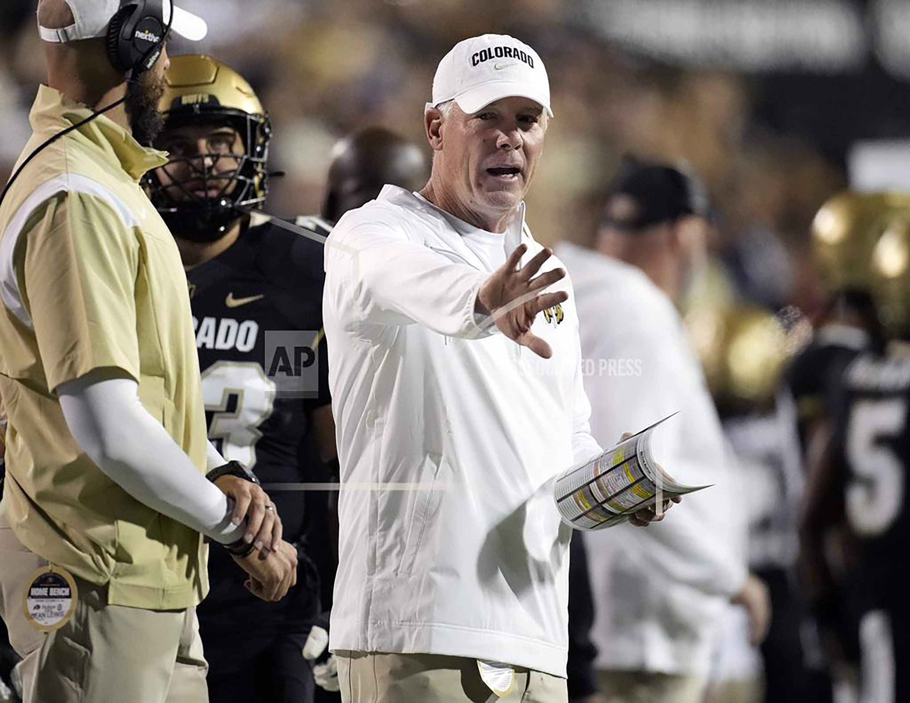 FILE - Then Colorado quality control analyst Pat Shurmur, right, gestures in the second half of an NCAA college football game against Colorado State, Sept. 16, 2023, in Boulder, Colo. Shurmur is entering his first full season as Colorado's offensive coordinator after calling plays for the team's final four contests in 2023. 