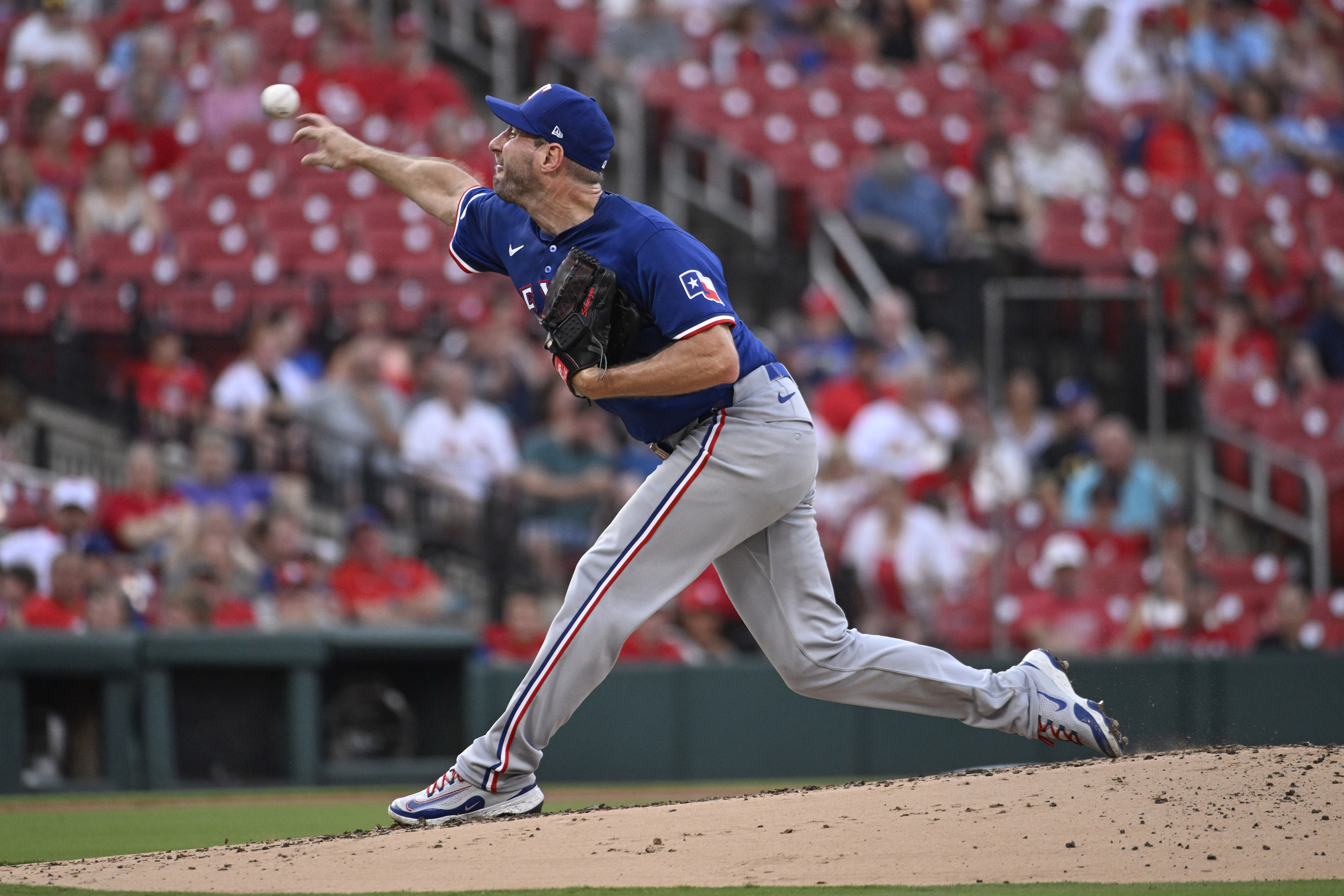 Texas Rangers starting pitcher Max Scherzer throws in the first inning of a baseball game against the St. Louis Cardinals, Tuesday, July 30, 2024, in St. Louis. 