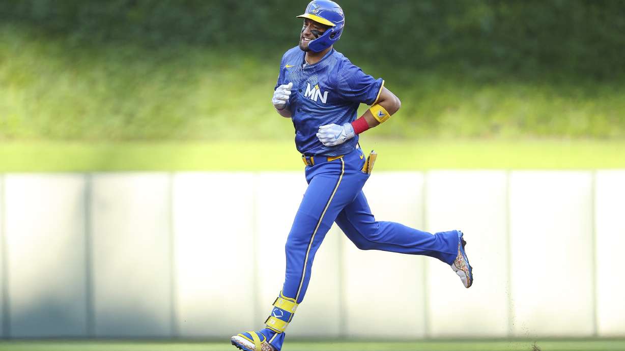 Minnesota Twins designated hitter Royce Lewis runs the bases after hitting a two-run home run against the Chicago White Sox during the first inning of a baseball game, Friday, Aug. 2, 2024, in Minneapolis.