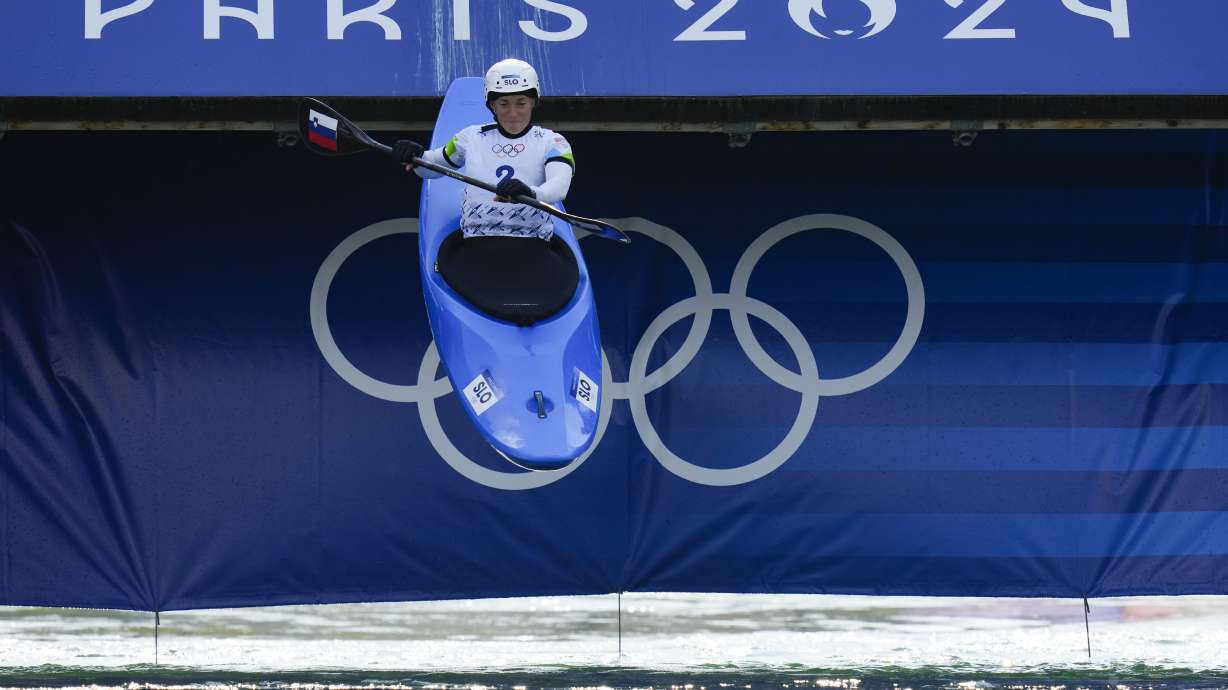 Eva Tercelj of Slovenia competes in the women's kayak cross time trial at the 2024 Summer Olympics, Friday, Aug. 2, 2024, in Vaires-sur-Marne, France.