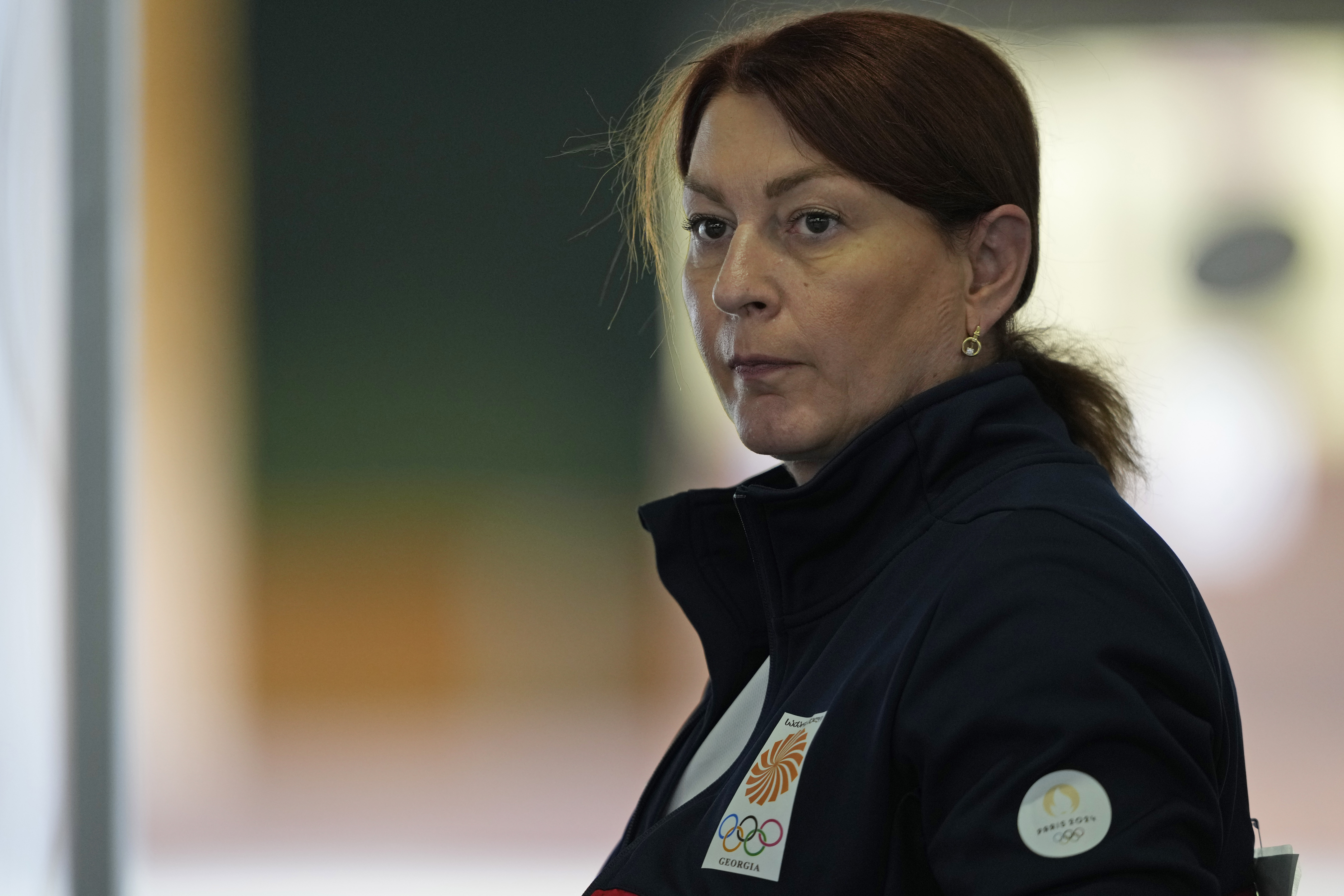 Georgia's Nino Salukvadze gestures as she competes in the 25m pistol rapid women's qualification round at the 2024 Summer Olympics, Friday, Aug. 2, 2024, in Chateauroux, France.
