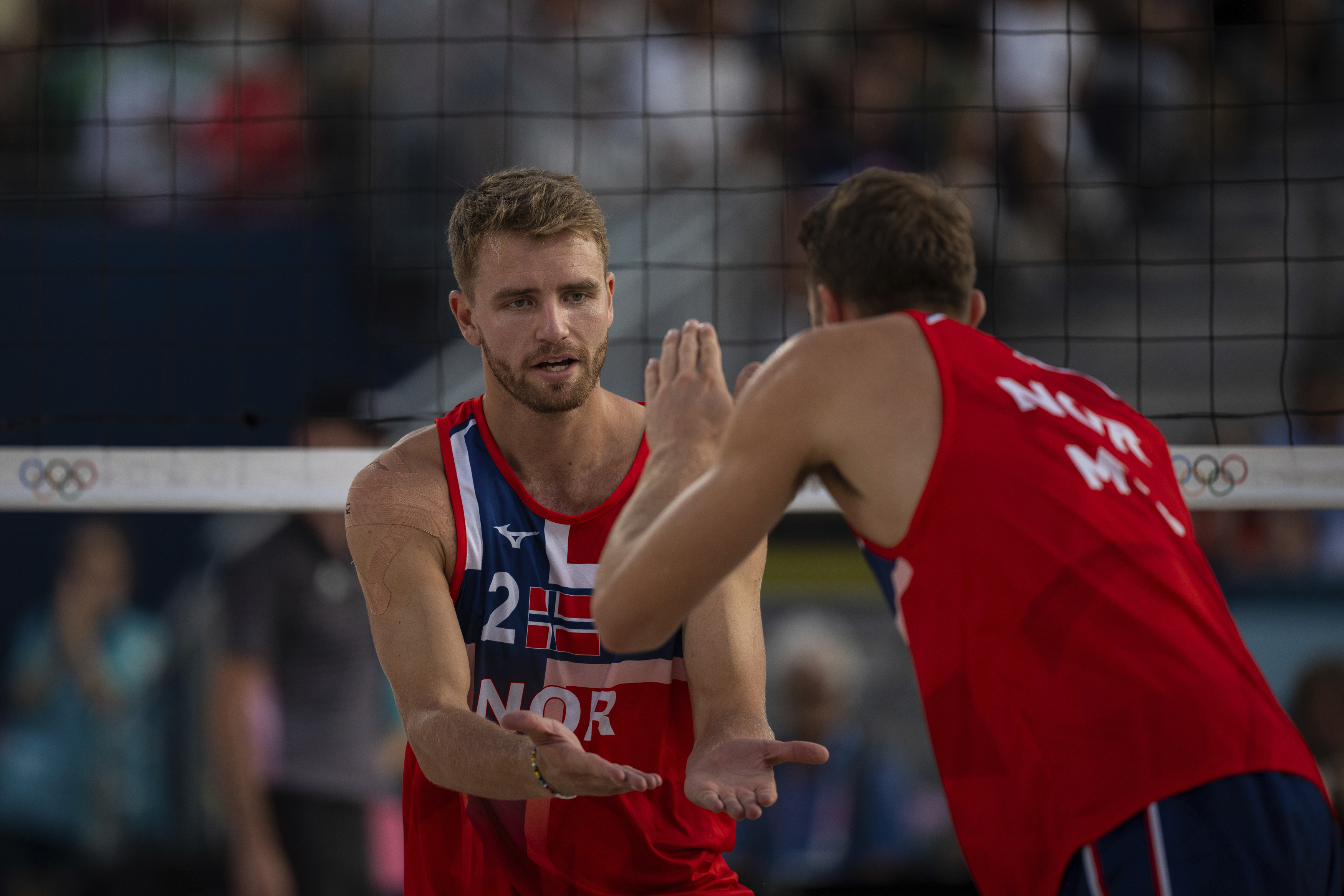 Norway's Christian Sandlie Soerum, left, and Anders Berntsen Mol react during the men's pool B beach volleyball match between Norway and Netherlands at Eiffel Tower Stadium at the 2024 Summer Olympics, Friday, Aug. 2, 2024, in Paris, France. 