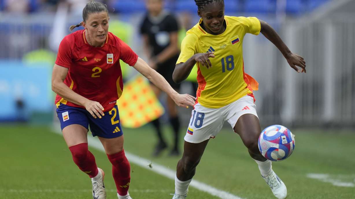 Colombia's Linda Caicedo, right, and Spain's Ona Batlle battle for the ball during the women's quarter-final soccer match between Spain and Colombia, at Lyon Stadium, during the 2024 Summer Olympics, Saturday, Aug. 3, 2024, in Decines, France.
