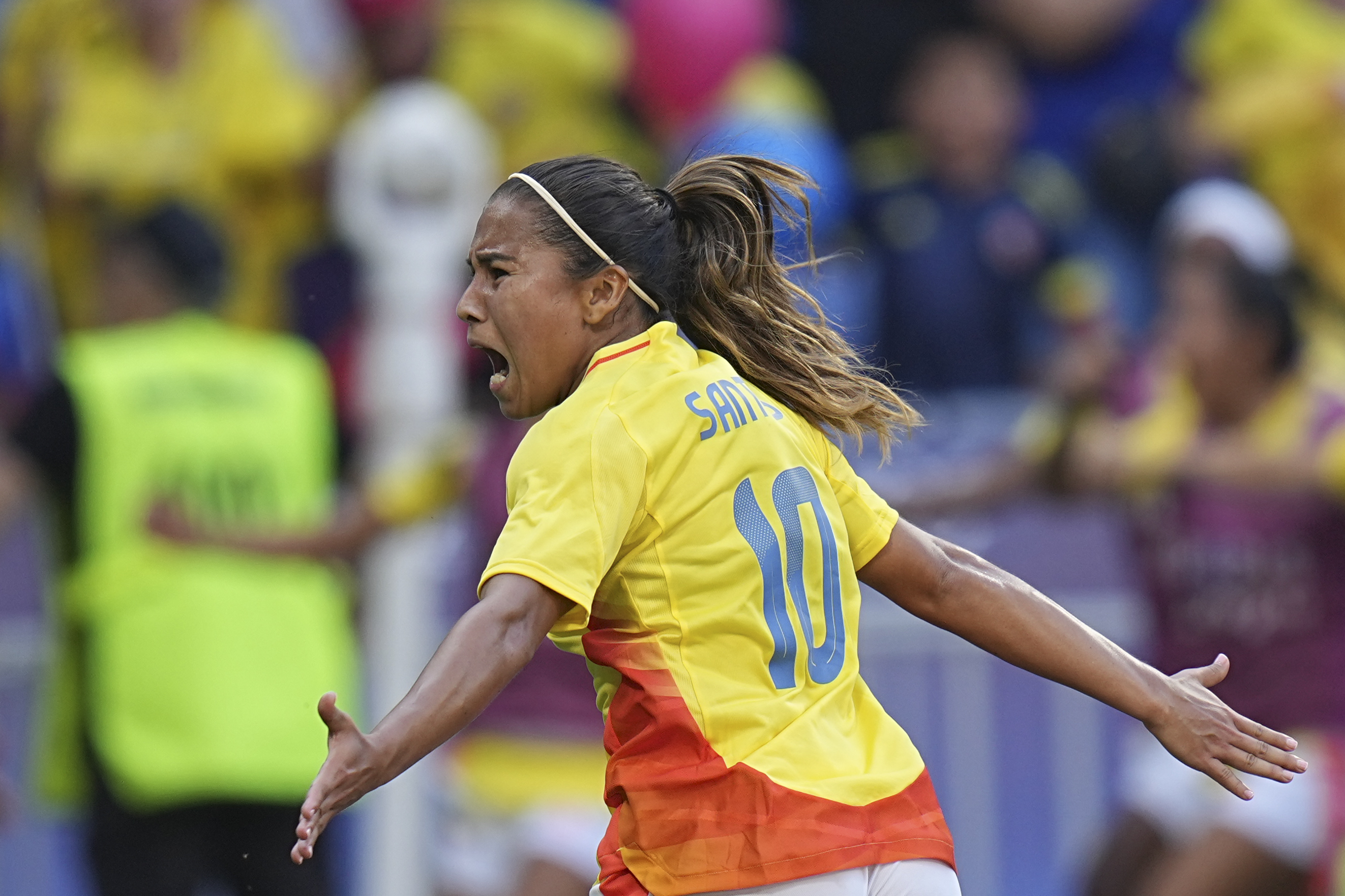 Colombia's Leicy Santos celebrates after scoring her side's 2nd goal during the women's quarter-final soccer match between Spain and Colombia, at Lyon Stadium, during the 2024 Summer Olympics, Saturday, Aug. 3, 2024, in Decines, France. 