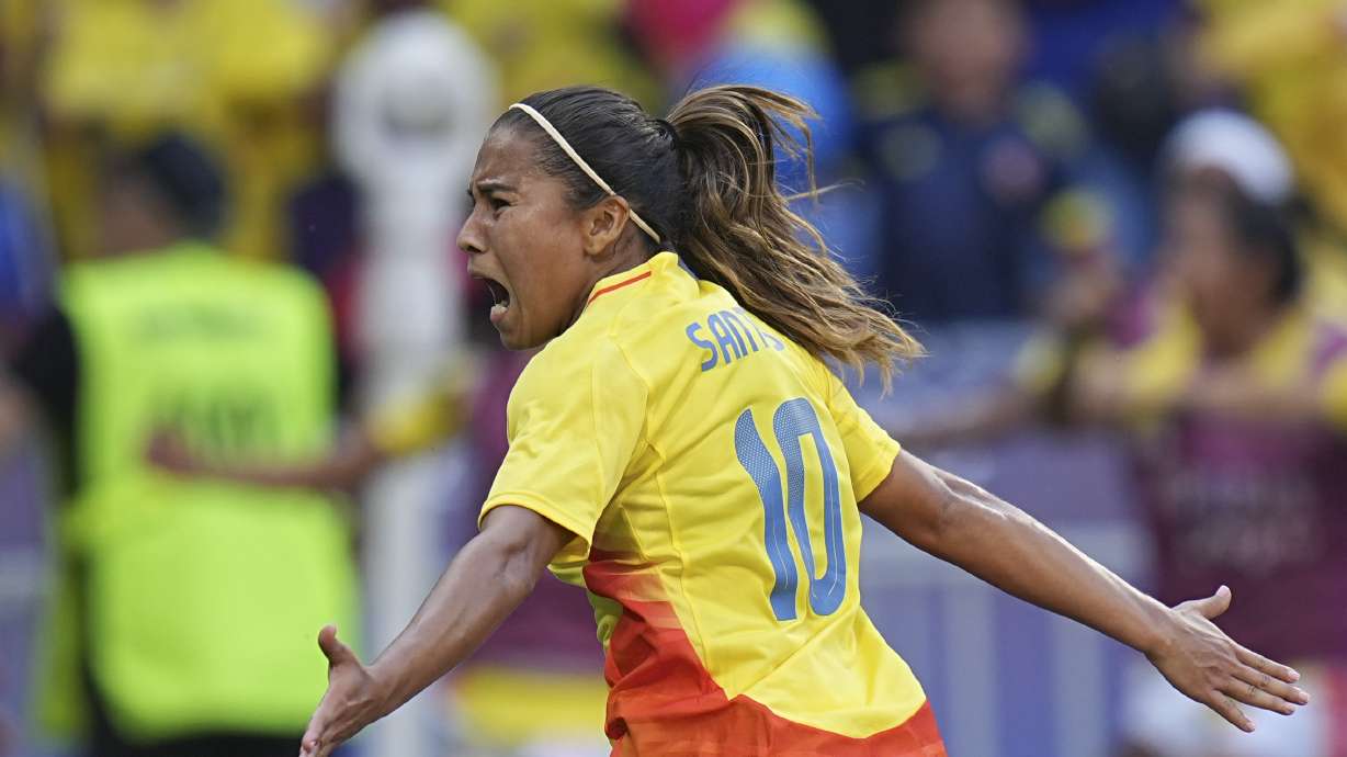 Colombia's Leicy Santos celebrates after scoring her side's 2nd goal during the women's quarter-final soccer match between Spain and Colombia, at Lyon Stadium, during the 2024 Summer Olympics, Saturday, Aug. 3, 2024, in Decines, France.