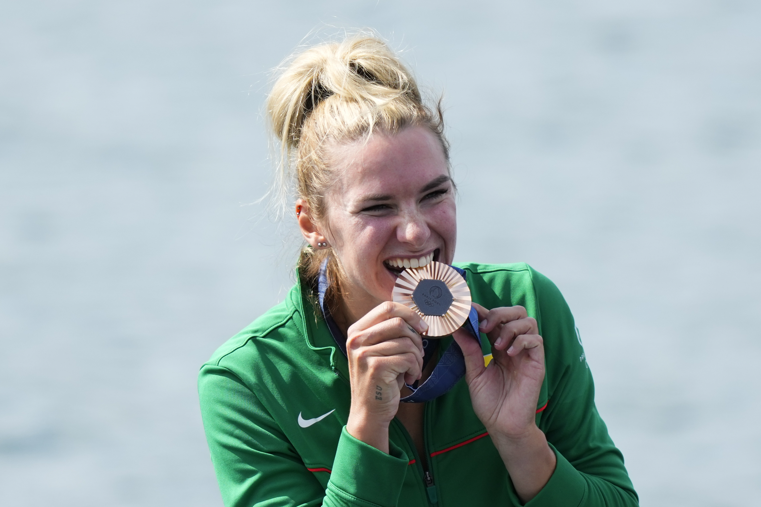 Viktorija Senkute, of Lithuania, poses with the bronze medal in the women's single sculls rowing final at the 2024 Summer Olympics, Saturday, Aug. 3, 2024, in Vaires-sur-Marne, France.