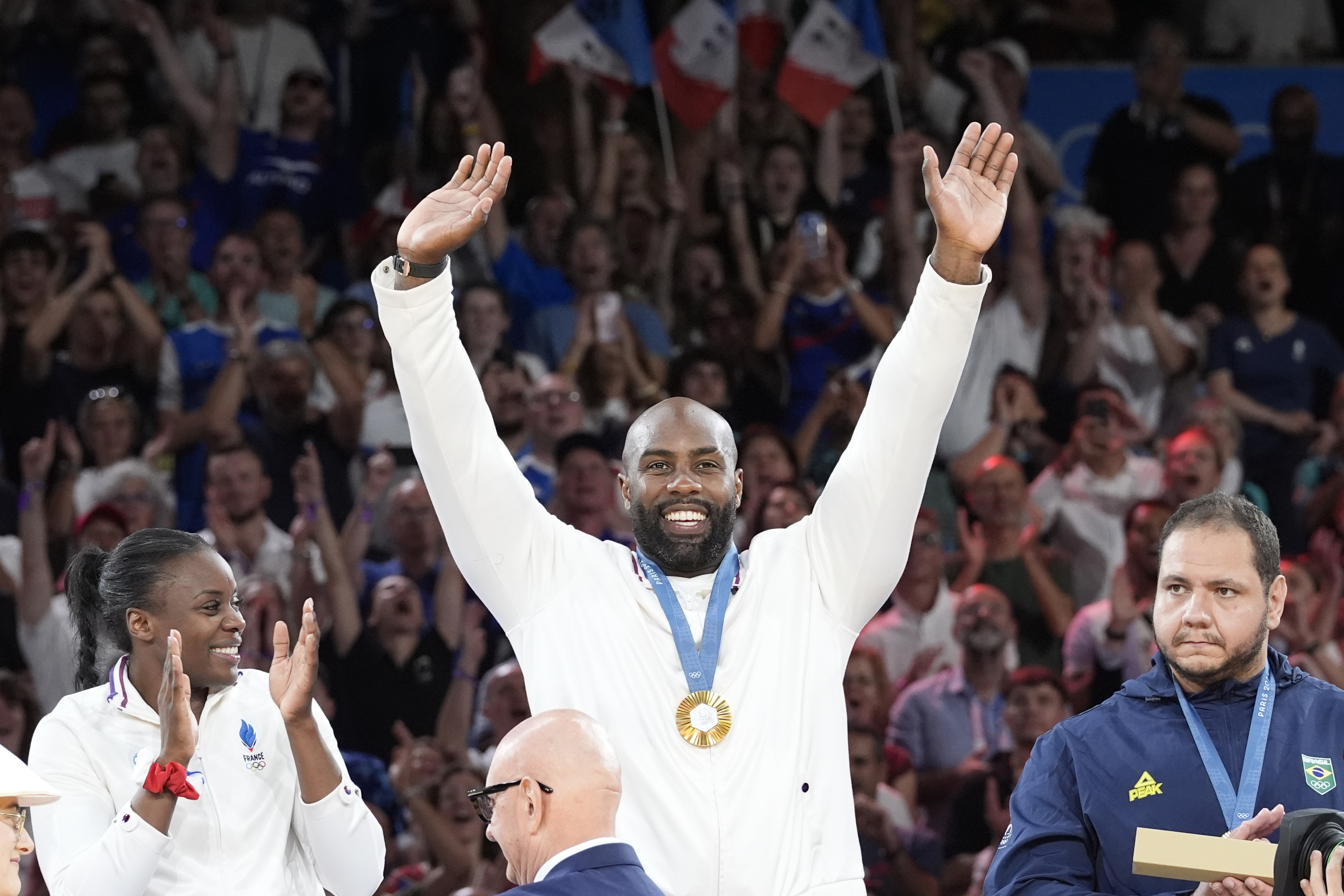 France's Teddy Riner celebrates during the award ceremony of the judo mixed team competition, at Champ-de-Mars Arena, during the 2024 Summer Olympics, Saturday, Aug. 3, 2024, in Paris, France. 