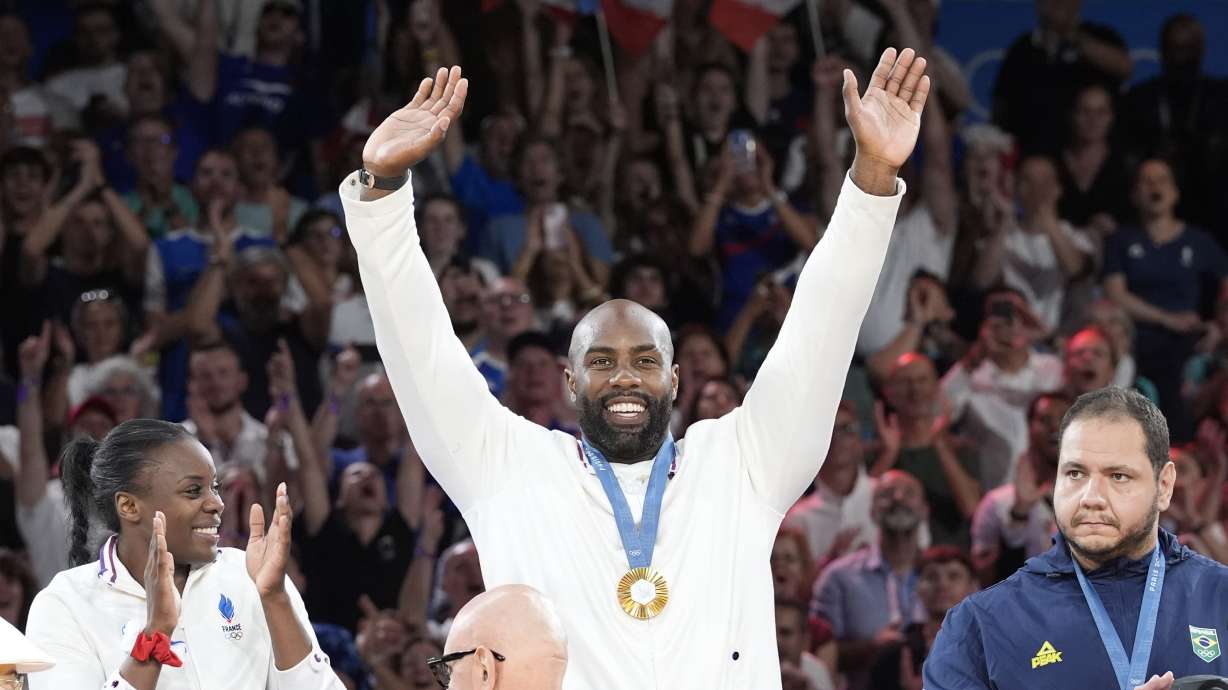 France's Teddy Riner celebrates during the award ceremony of the judo mixed team competition, at Champ-de-Mars Arena, during the 2024 Summer Olympics, Saturday, Aug. 3, 2024, in Paris, France.