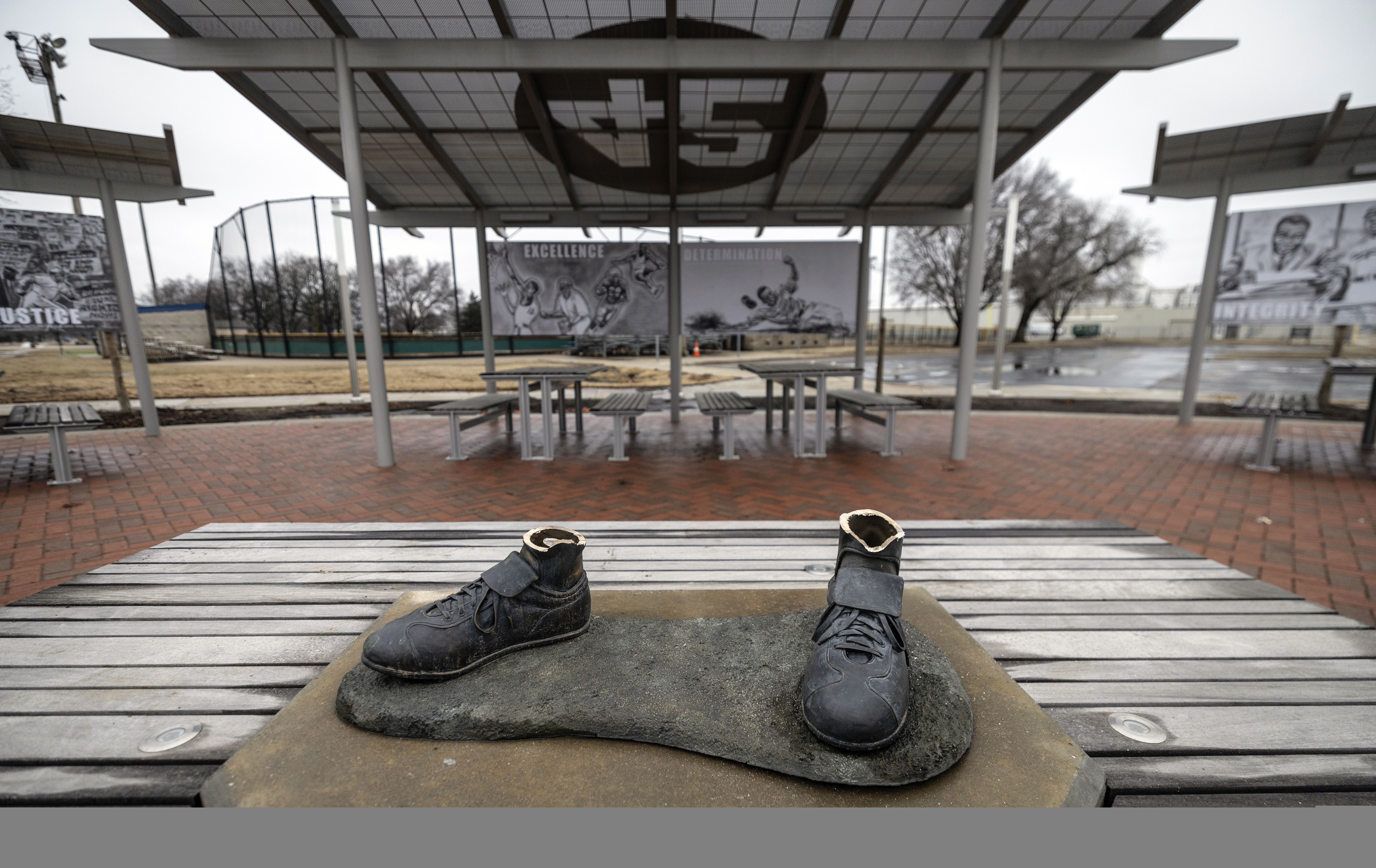 FILE - A view of the bronze Jackie Robinson cleats that were left behind when the statue of the legendary baseball pioneer was stolen from a park in the early morning hours, in Wichita, Kan., Jan. 25, 2024. 