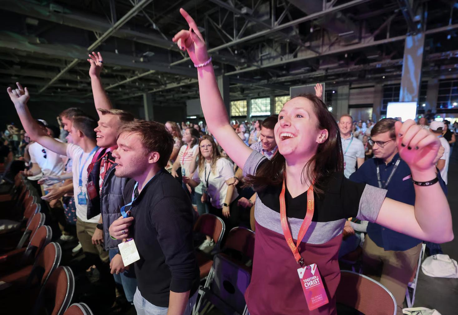 Attendees dance as a DJ plays music before the opening speakers at the 2024 Utah Area Young Single Adult Conference at the Salt Palace Convention Center in Salt Lake City on Friday.