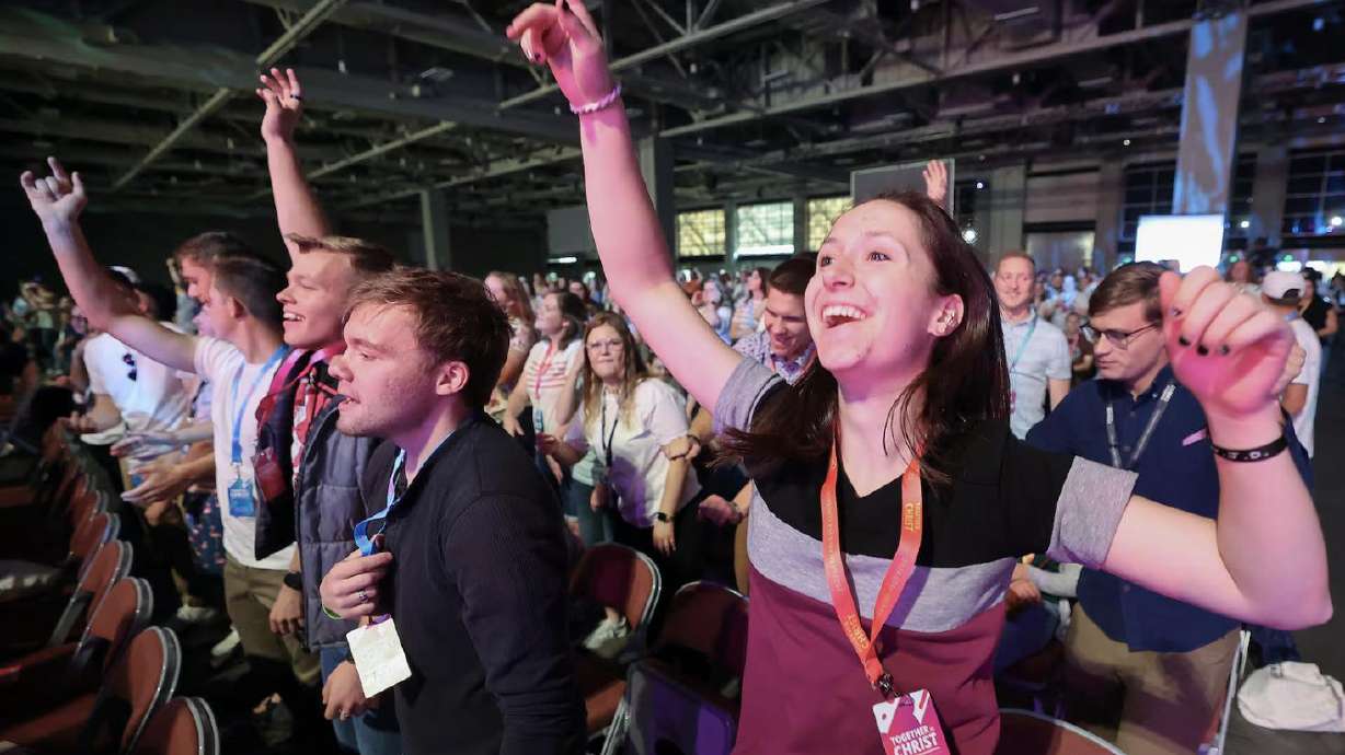Attendees dance as a DJ plays music before the opening speakers at the 2024 Utah Area Young Single Adult Conference at the Salt Palace Convention Center in Salt Lake City on Friday.