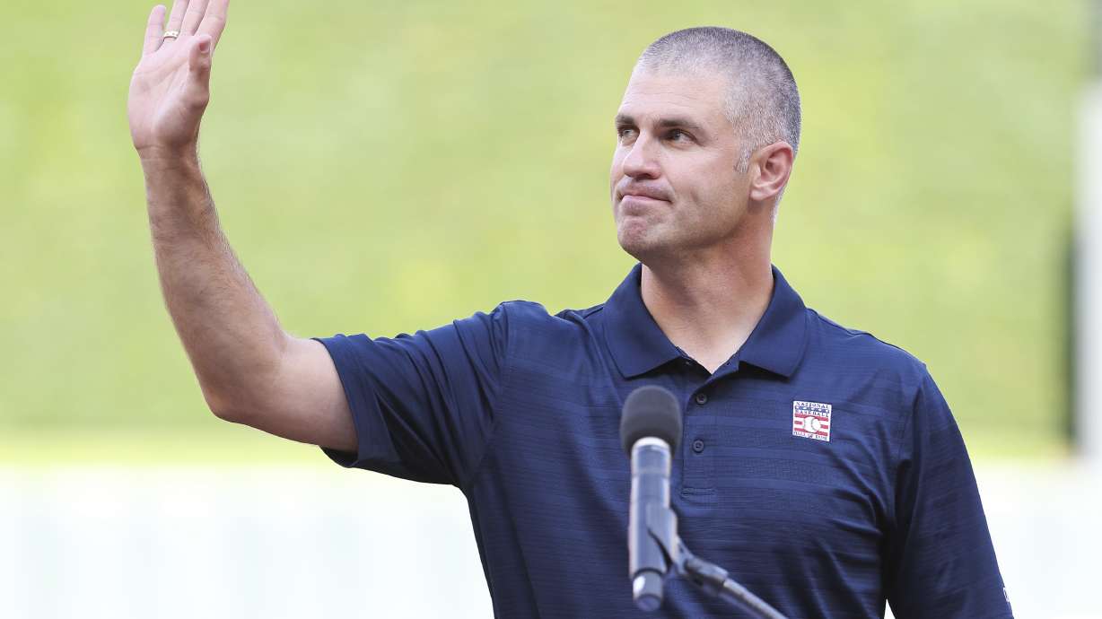Former Minnesota Twins player Joe Mauer acknowledges the crowd during a ceremony honoring his induction into the National Baseball Hall of Fame before a baseball game between the Chicago White Sox and the Twins, Saturday, Aug. 3, 2024, in Minneapolis.