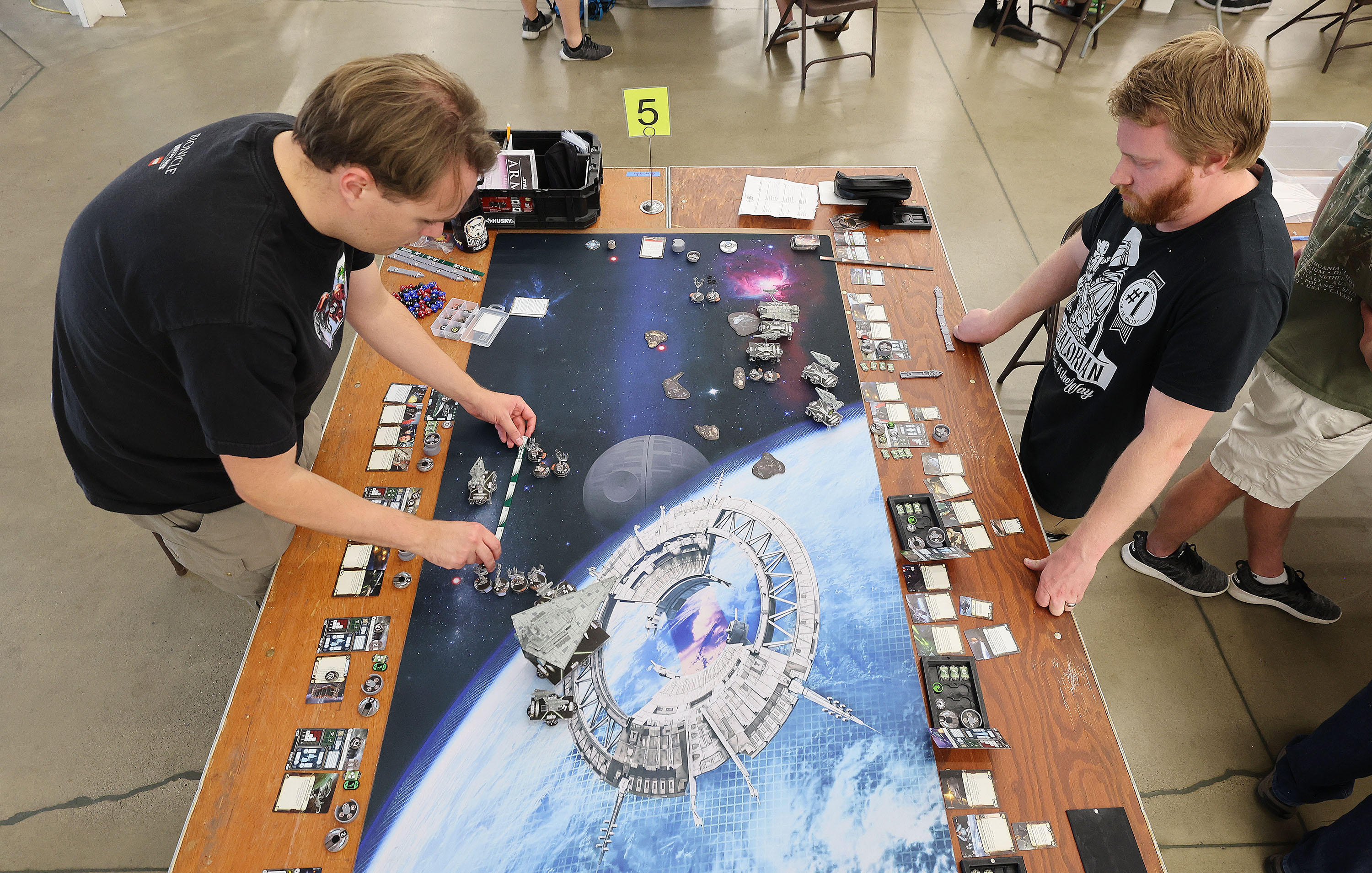 James Eaton and Justin Robbins play Star Wars Armada during the Sci-Fi, Fantasy and Historical Tabletop Gaming Convention at the Utah State Fairpark in Salt Lake City on Saturday.
