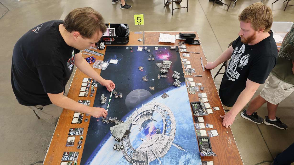 James Eaton and Justin Robbins play Star Wars Armada during the Sci-Fi, Fantasy and Historical Tabletop Gaming Convention at the Utah State Fairpark in Salt Lake City on Saturday.