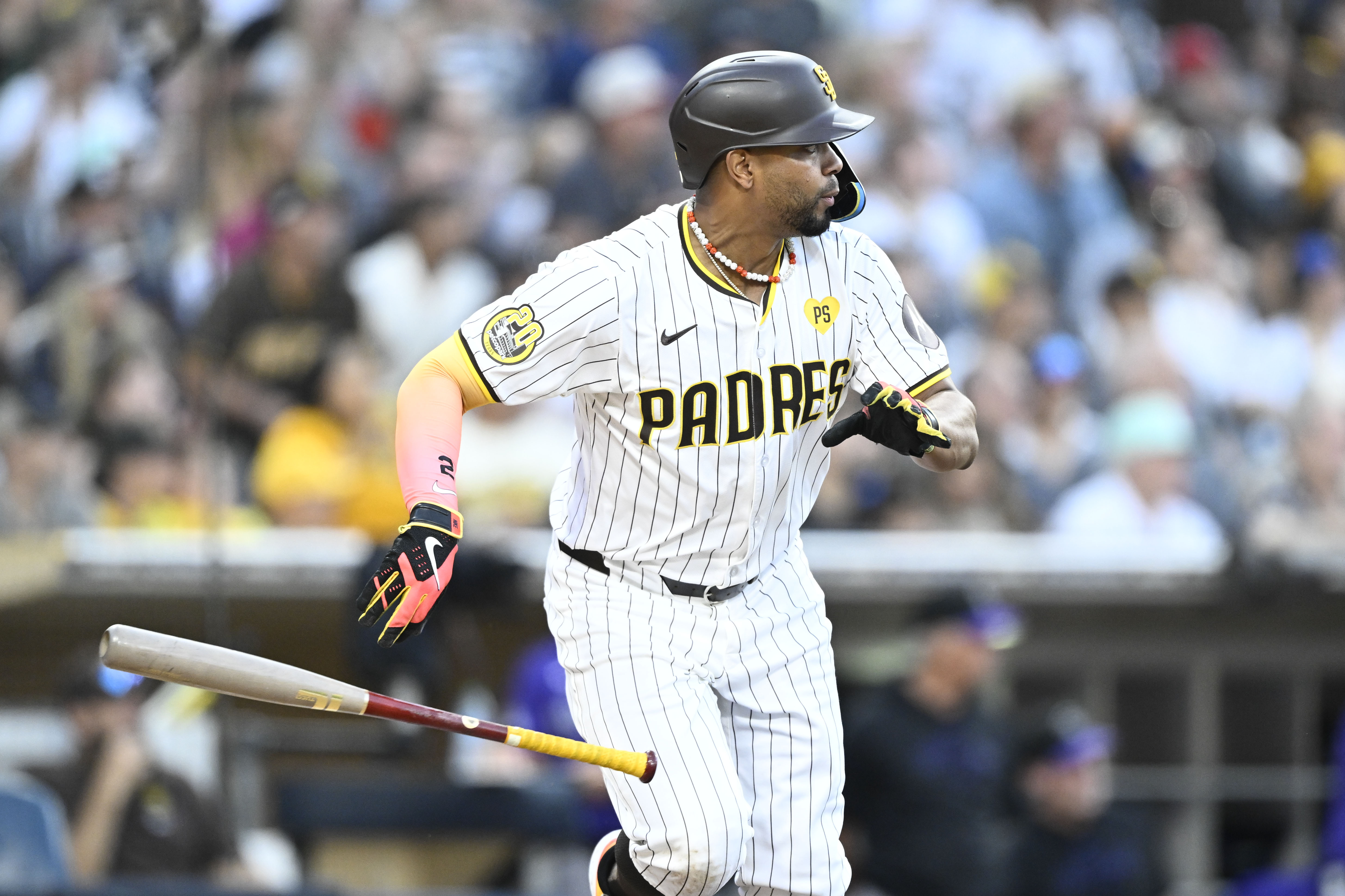 San Diego Padres' Xander Bogaerts hits an RBI single during the seventh inning of a baseball game against the Colorado Rockies, Saturday, Aug. 3, 2024, in San Diego. 