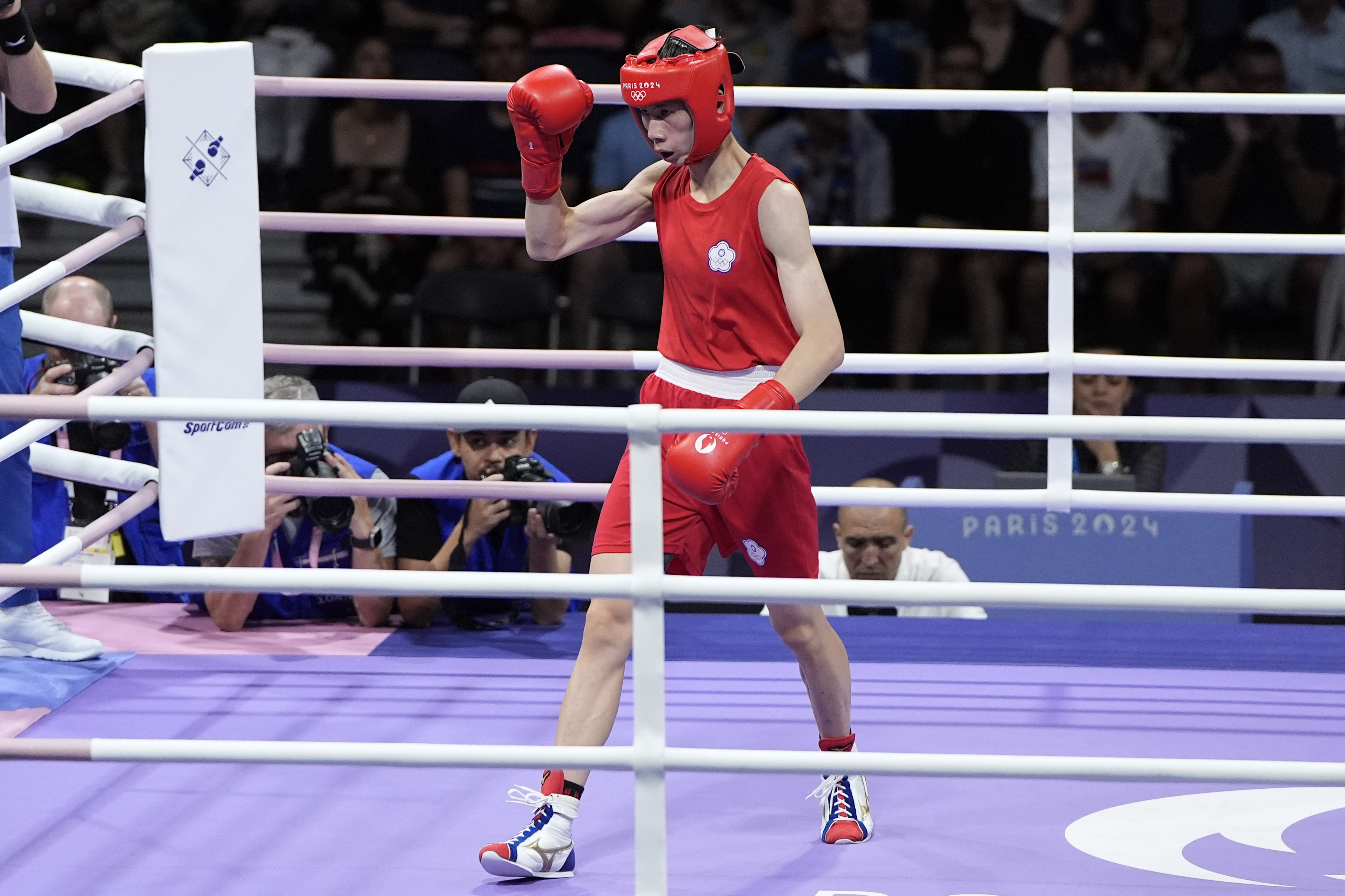 Taiwan's Lin Yu-ting motions between rounds against Bulgaria's Svetlana Staneva in their women's 57 kg quarterfinal boxing match at the 2024 Summer Olympics, Sunday, Aug. 4, 2024, in Paris, France. 