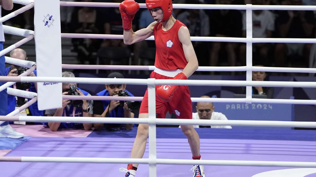 Taiwan's Lin Yu-ting motions between rounds against Bulgaria's Svetlana Staneva in their women's 57 kg quarterfinal boxing match at the 2024 Summer Olympics, Sunday, Aug. 4, 2024, in Paris, France.