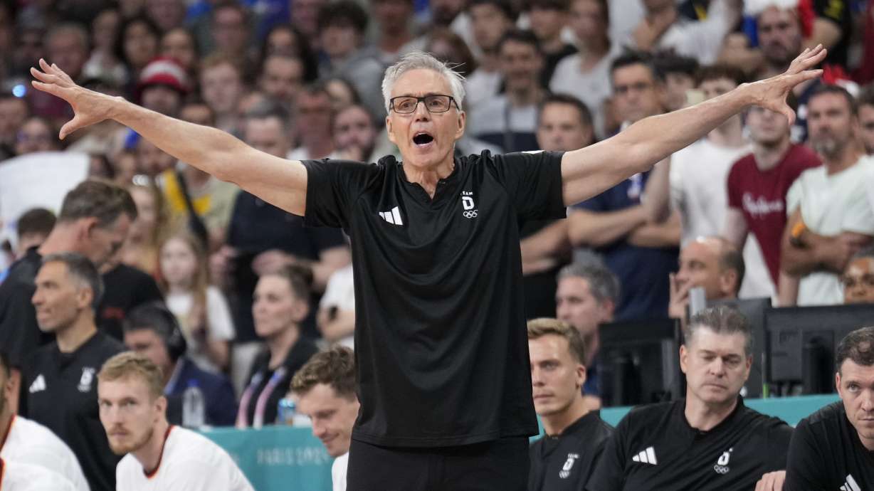 Germany head coach Gordie Herbert gestures in a men's basketball game against France at the 2024 Summer Olympics, Friday, Aug. 2, 2024, in Villeneuve-d'Ascq, France.