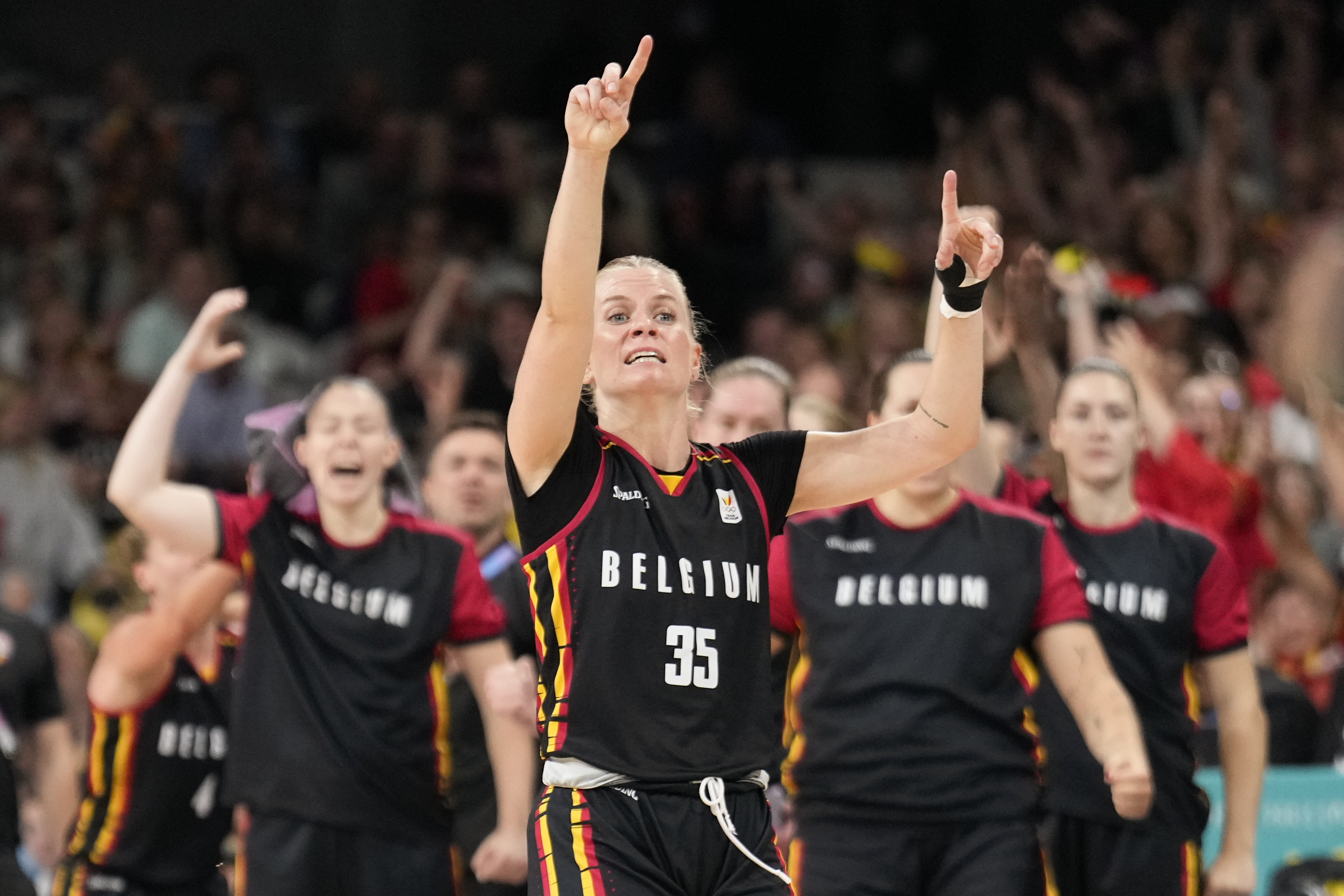 Julie Vanloo (35), of Belgium, celebrates after a basket against Japan in a women's basketball game at the 2024 Summer Olympics, Sunday, Aug. 4, 2024, in Villeneuve-d'Ascq, France. 