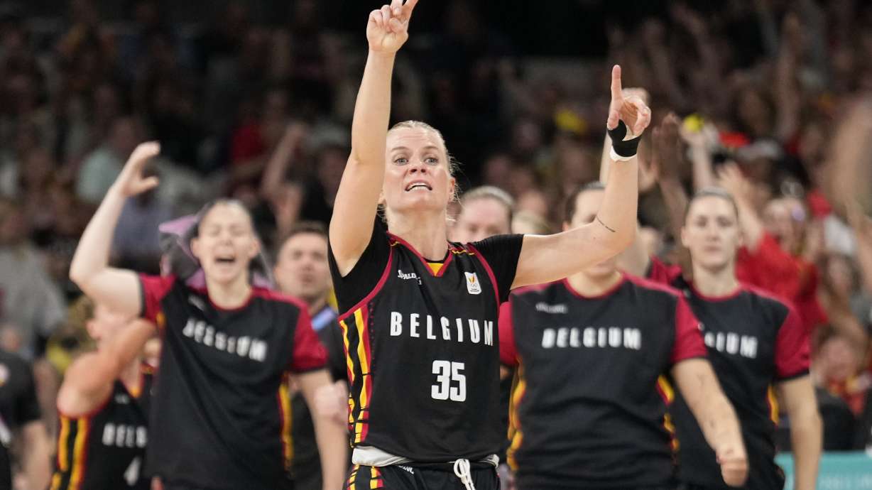 Julie Vanloo (35), of Belgium, celebrates after a basket against Japan in a women's basketball game at the 2024 Summer Olympics, Sunday, Aug. 4, 2024, in Villeneuve-d'Ascq, France.