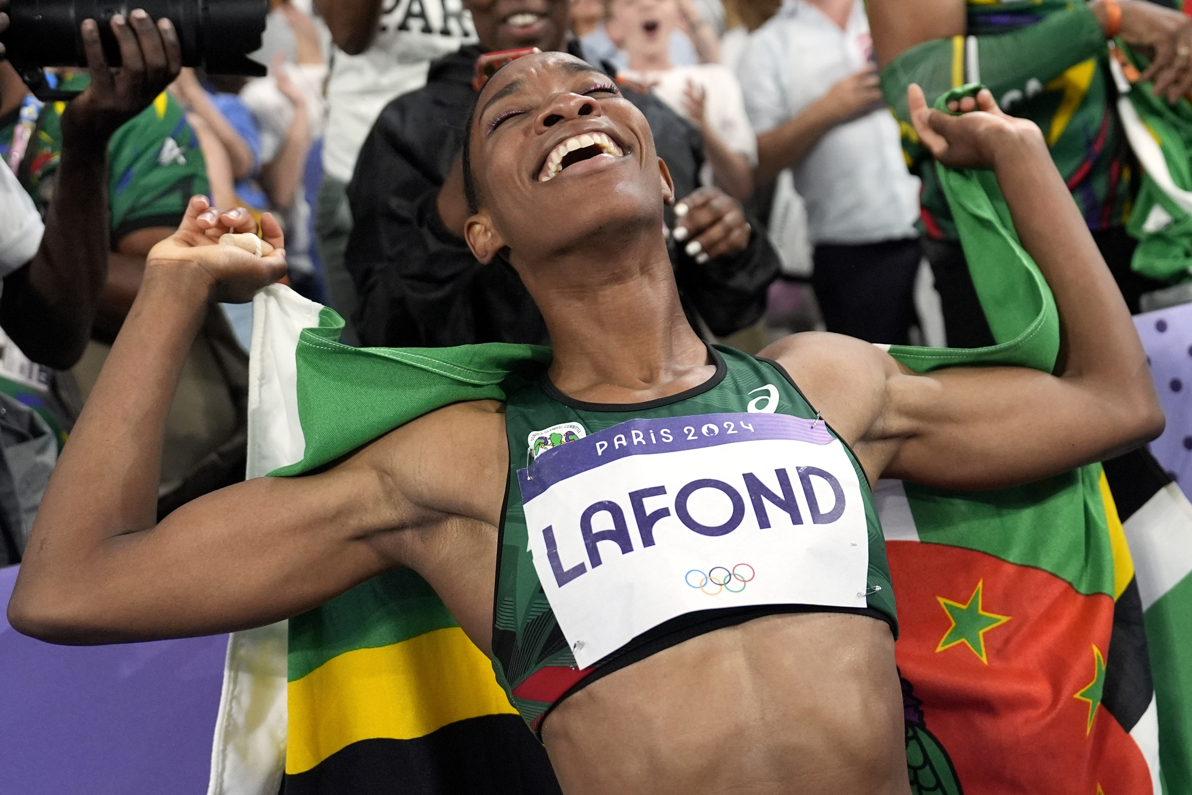 Thea Lafond, of Dominica, celebrates after winning the women's triple jump final at the 2024 Summer Olympics, Saturday, Aug. 3, 2024, in Saint-Denis, France. 