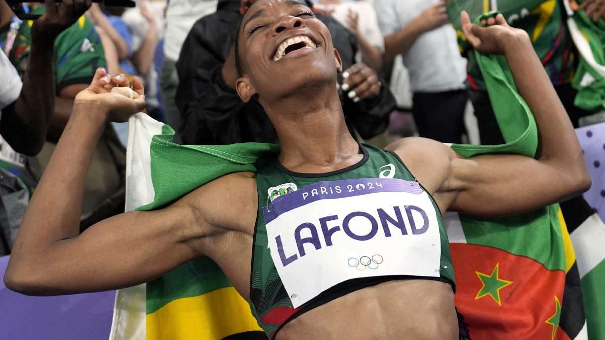 Thea Lafond, of Dominica, celebrates after winning the women's triple jump final at the 2024 Summer Olympics, Saturday, Aug. 3, 2024, in Saint-Denis, France.