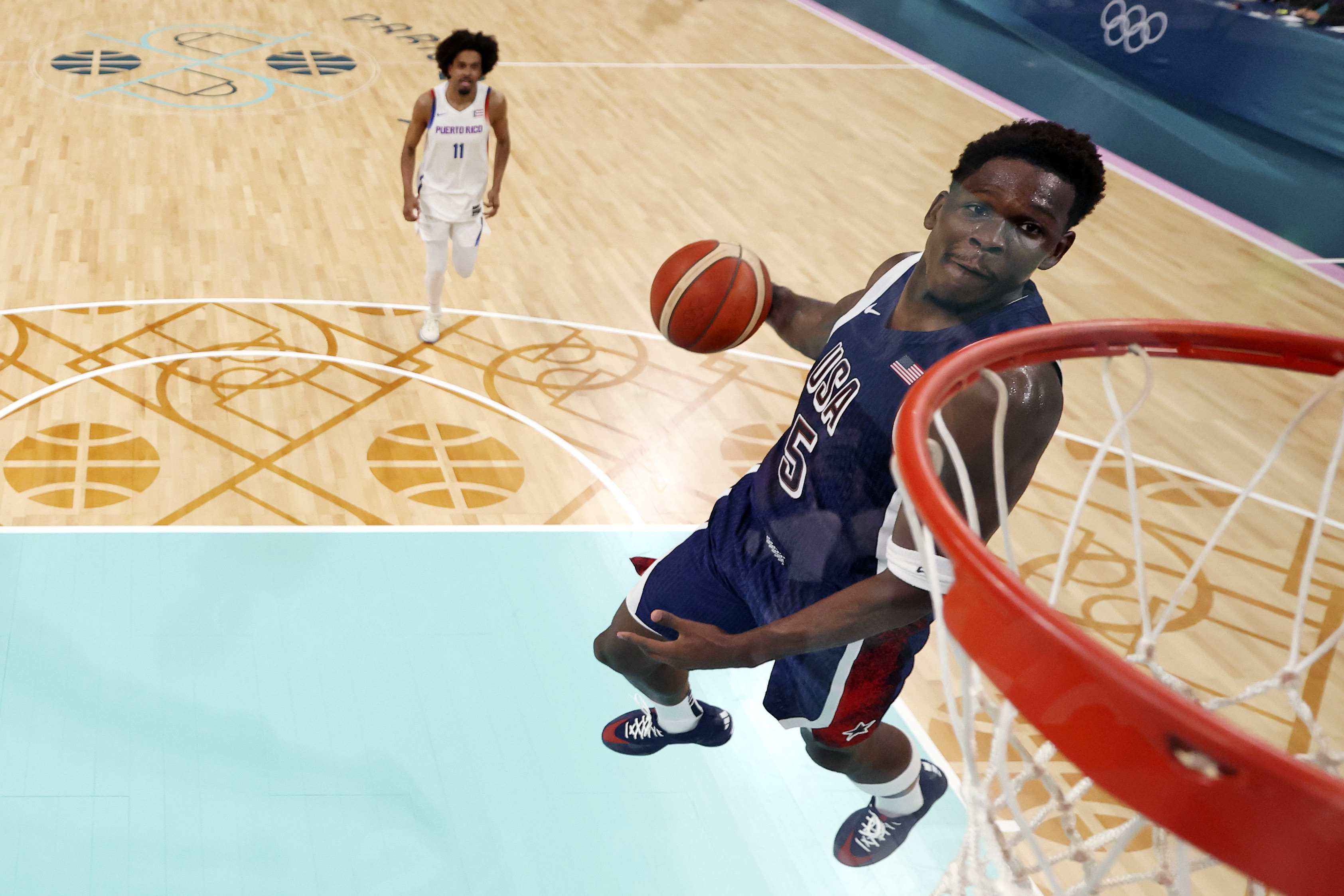 United States' Anthony Edwards dunks during a men's basketball game against Puerto Rico at the 2024 Summer Olympics, Saturday, Aug. 3, 2024, in Villeneuve-d'Ascq, France. 