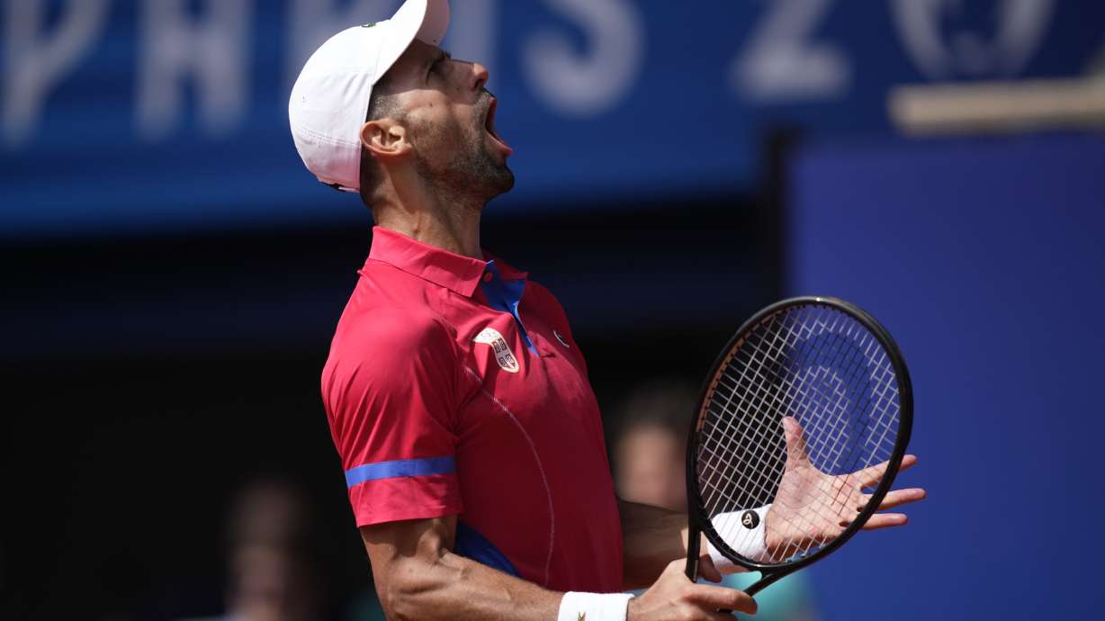 Serbia's Novak Djokovic reacts after awinning a point against Spain's Carlos Alcaraz during the men's singles tennis final at the Roland Garros stadium during the 2024 Summer Olympics, Sunday, Aug. 4, 2024, in Paris, France.