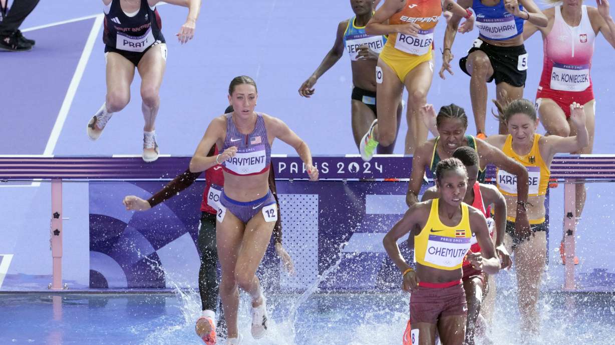Courtney Wayment of the United States, foreground left, competes in a women's 3000 meters steeplechase round 1 heat at the 2024 Summer Olympics, Sunday, Aug. 4, 2024, in Saint-Denis, France.
