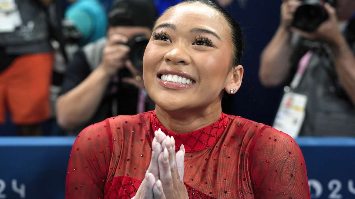 Suni Lee, of the United States, celebrates after winning the bronze medal during the women's artistic gymnastics individual uneven bars finals at Bercy Arena at the 2024 Summer Olympics, Sunday, Aug. 4, 2024, in Paris, France.