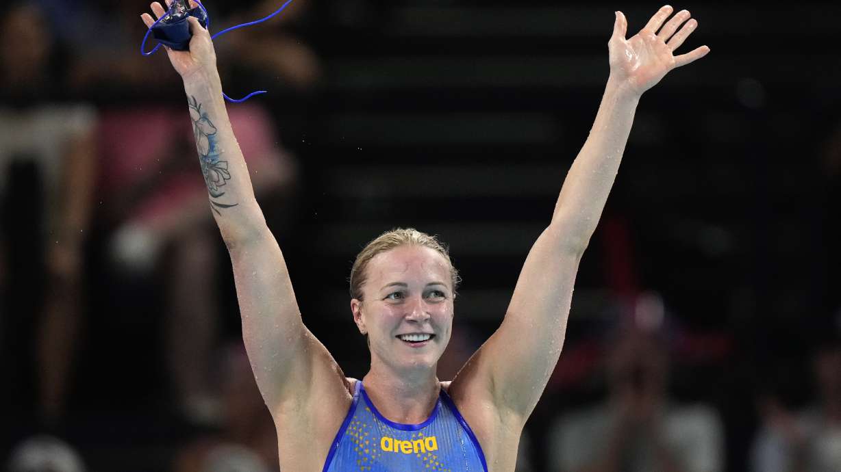 Sweden's Sarah Sjoestroem celebrates after winning the gold medal in the women's 50-meter freestyle final at the Summer Olympics in Nanterre, France, Sunday, Aug. 4, 2024.