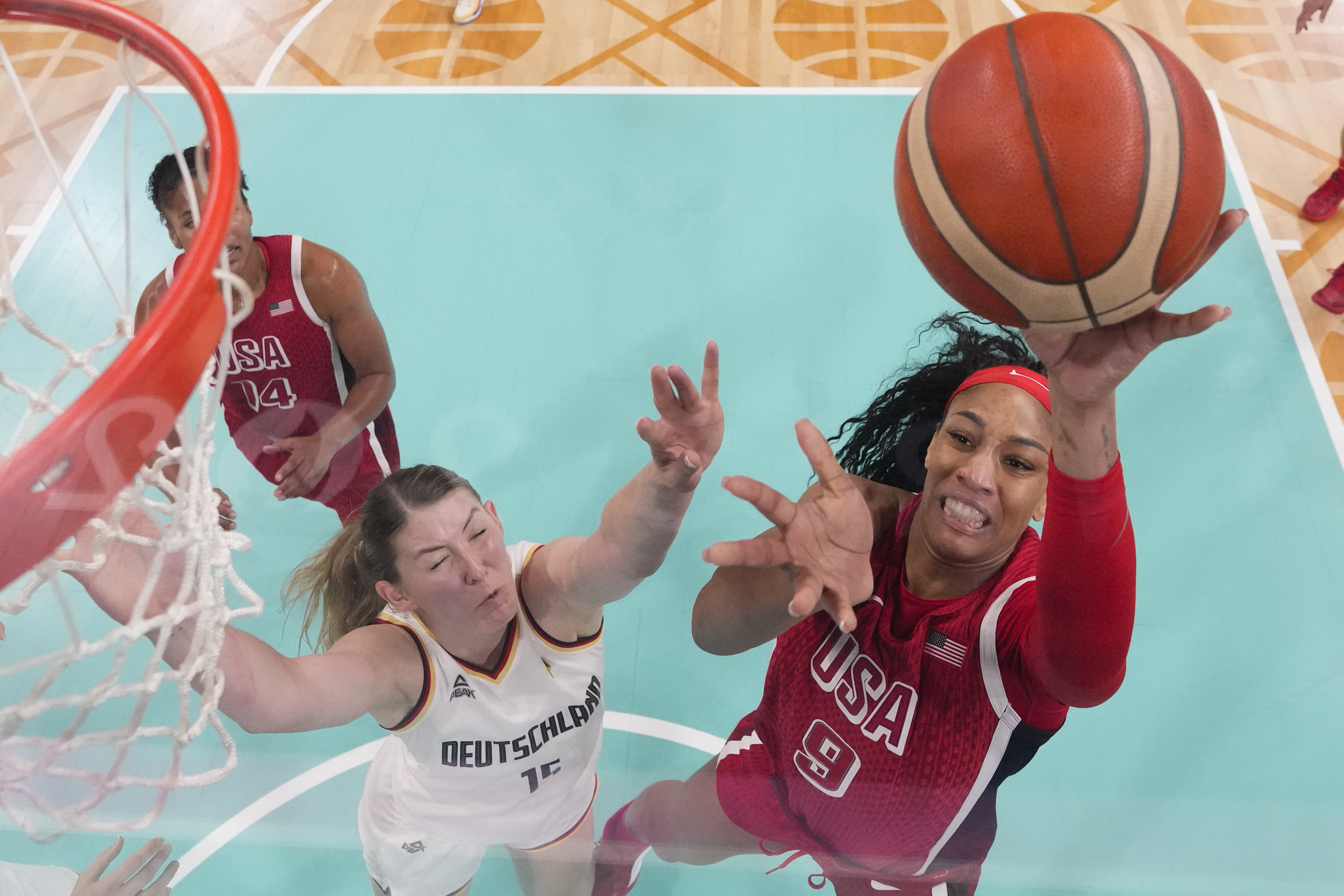 A'ja Wilson (9), of the United States, shoots over Luisa Geiselsoder (15), of Germany, in a women's basketball game at the 2024 Summer Olympics, Sunday, Aug. 4, 2024, in Villeneuve-d'Ascq, France.