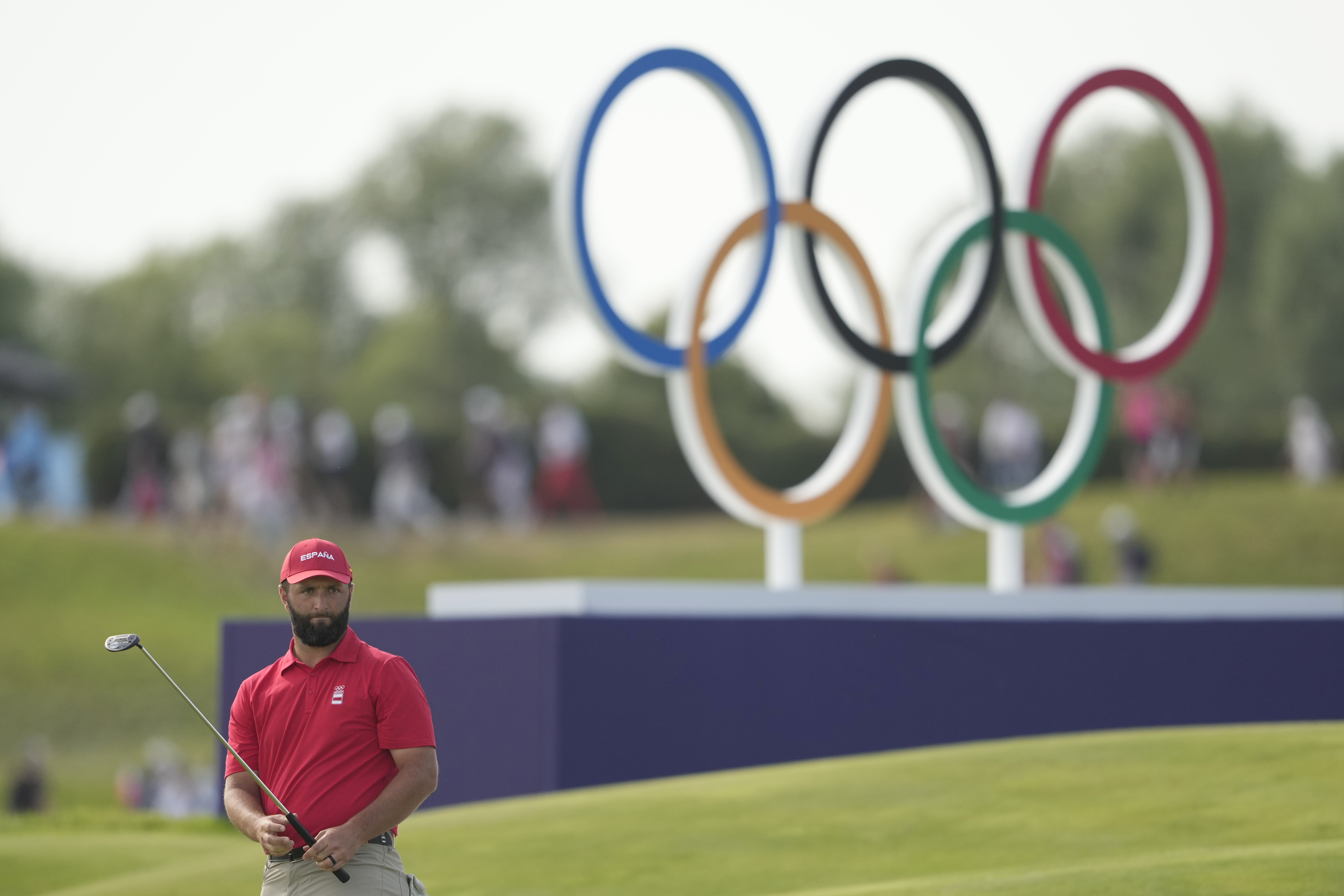 Jon Rahm, of Spain, watches his putt on the 18th green during the final round of the men's golf at the 2024 Summer Olympics, Sunday, Aug. 4, 2024, at Le Golf National in Saint-Quentin-en-Yvelines, France. Scottie Scheffler, of the United States, wins the gold medal with Tommy Fleetwood, of Britain, silver and Hideki Matsuyama, of Japan, the bronze. 