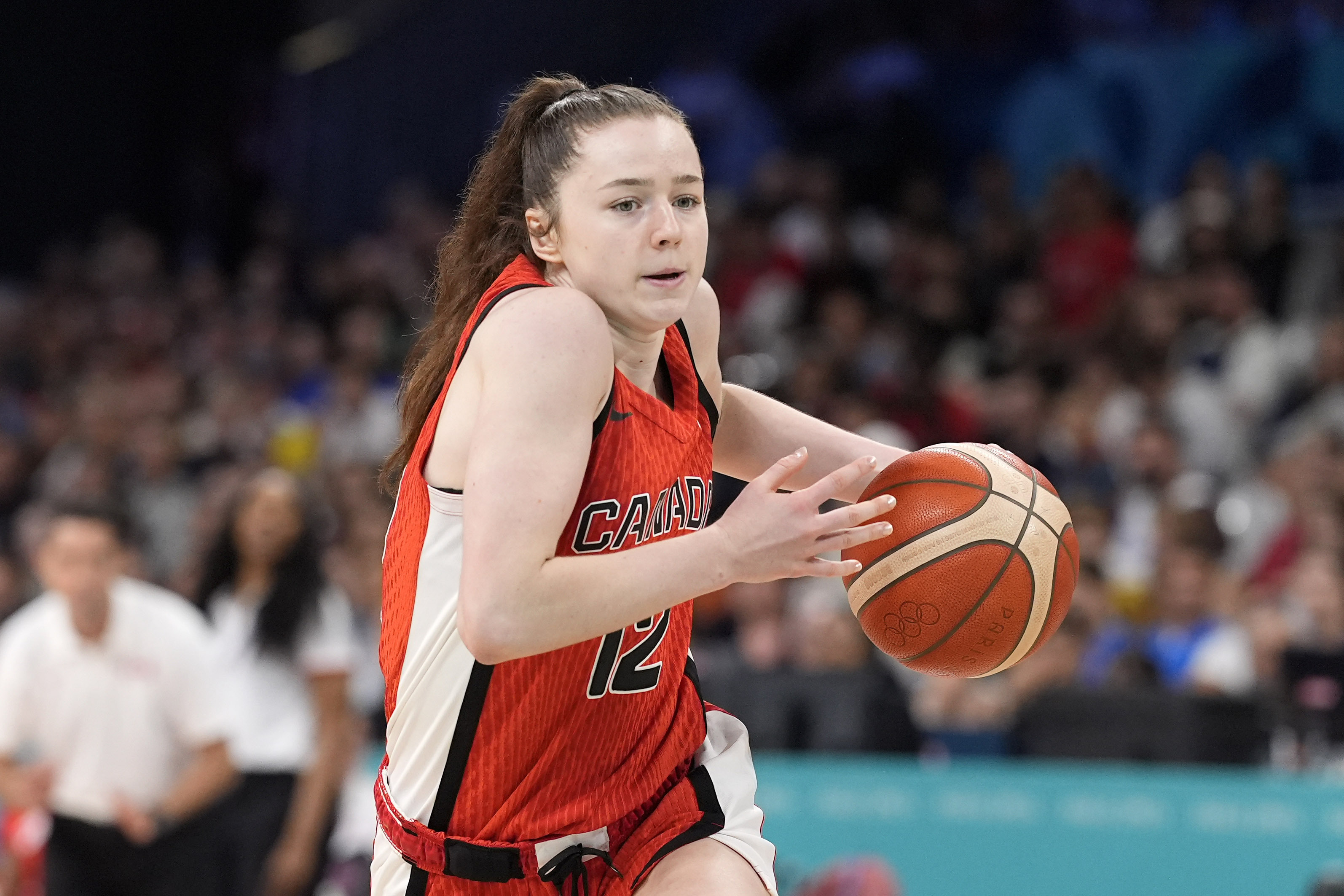 Canada's Syla Swords drives toward the basket during a women's basketball game against Canada at the 2024 Summer Olympics, Thursday, Aug. 1, 2024, in Villeneuve-d'Ascq, France. 