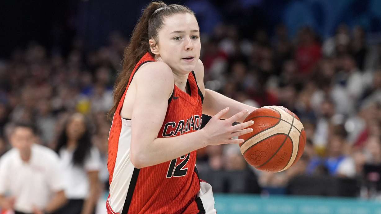 Canada's Syla Swords drives toward the basket during a women's basketball game against Canada at the 2024 Summer Olympics, Thursday, Aug. 1, 2024, in Villeneuve-d'Ascq, France.